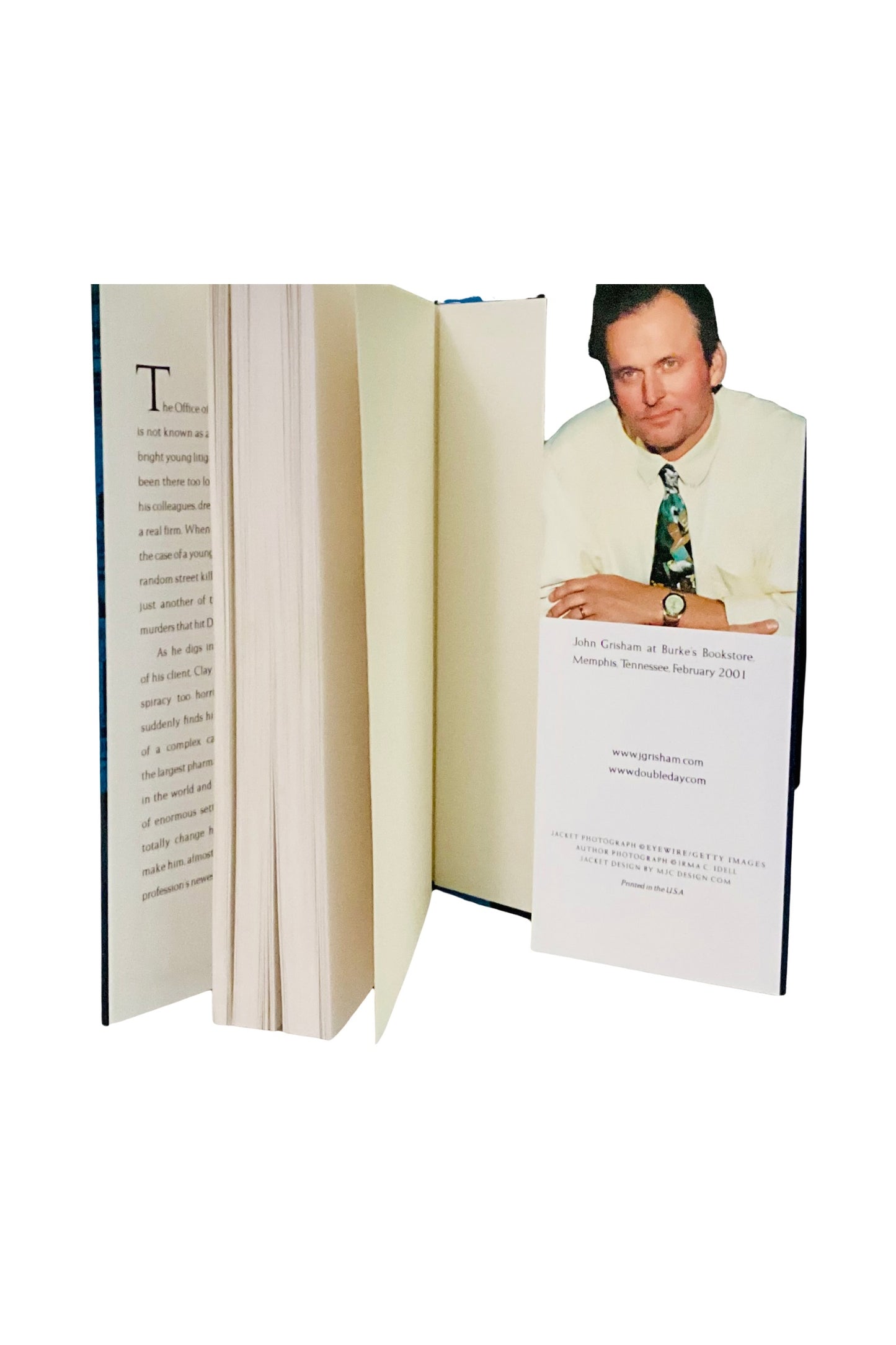 Open book showing a photo of the author on the inside back page