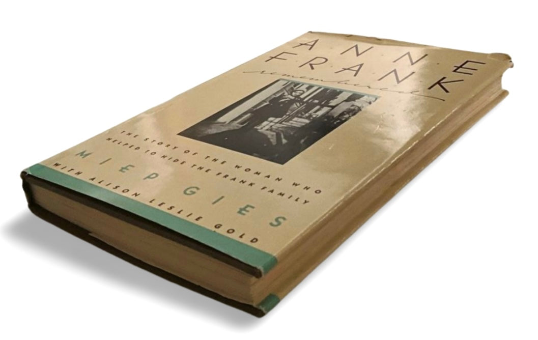 Book titled 'Anne Frank' with a photo of Anne Frank on the cover