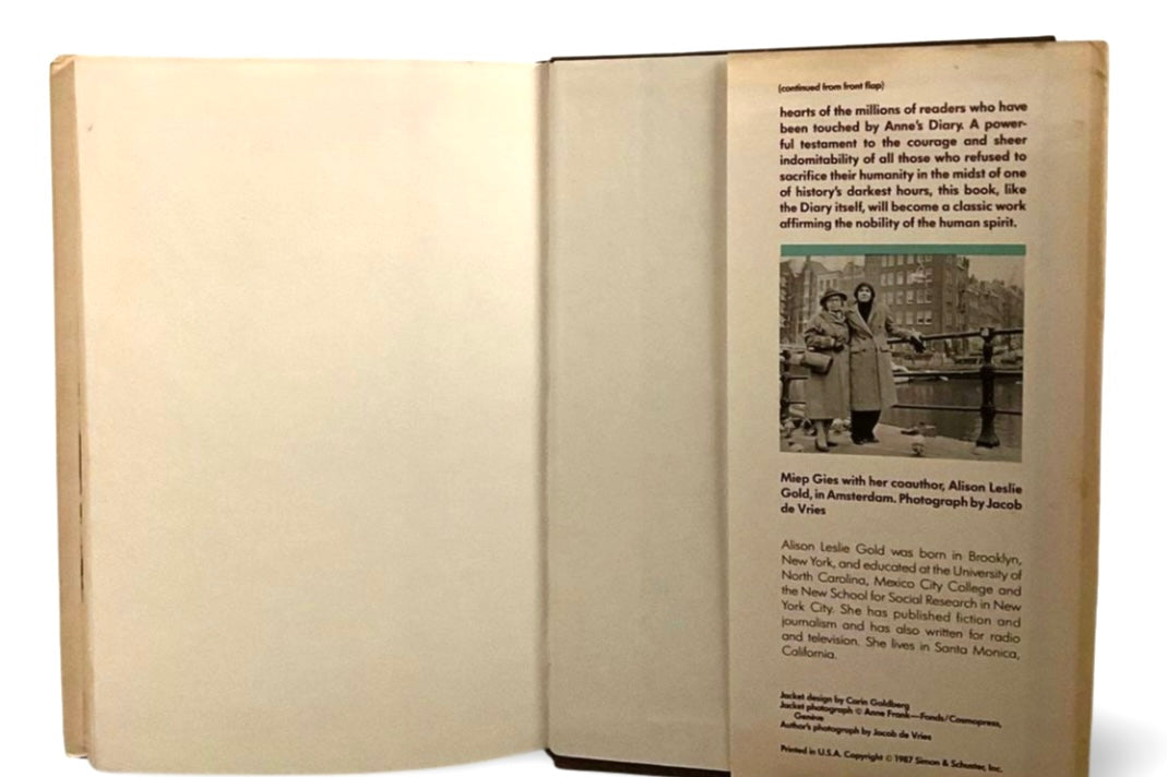 Open book with text and a black and white photo on a white background