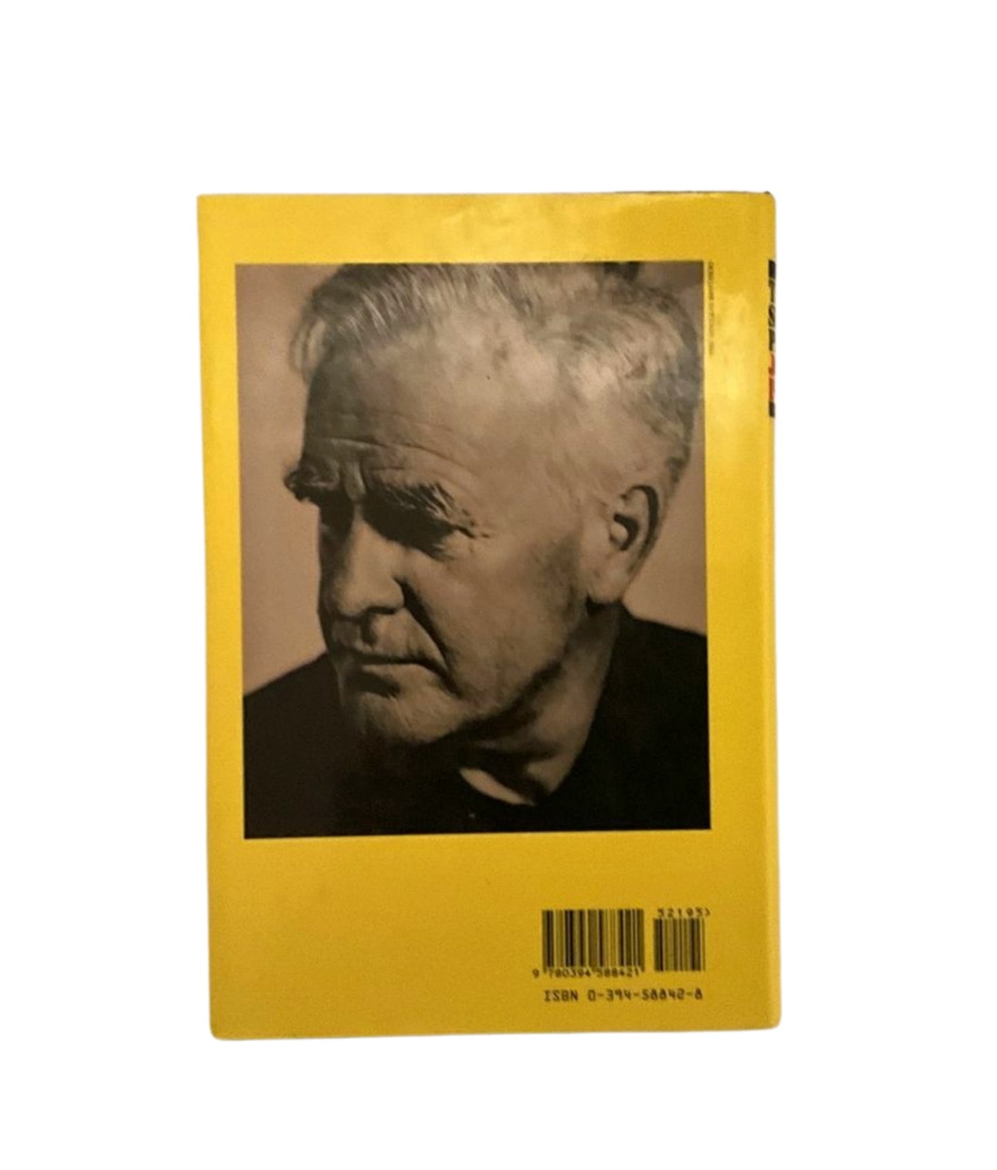 Back cover with a yellow background and a black and white portrait of the author