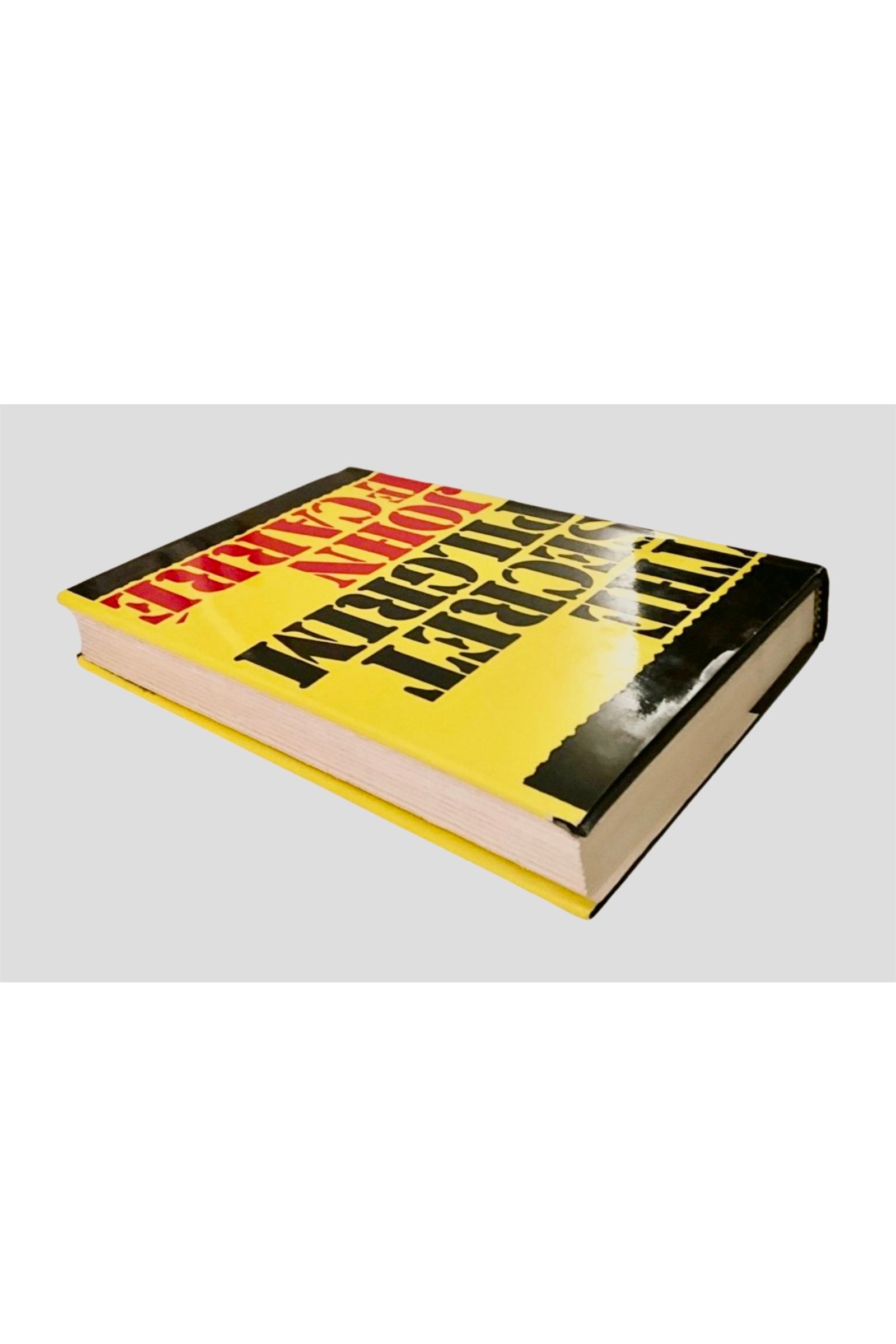 Book with a yellow and black cover on a white background