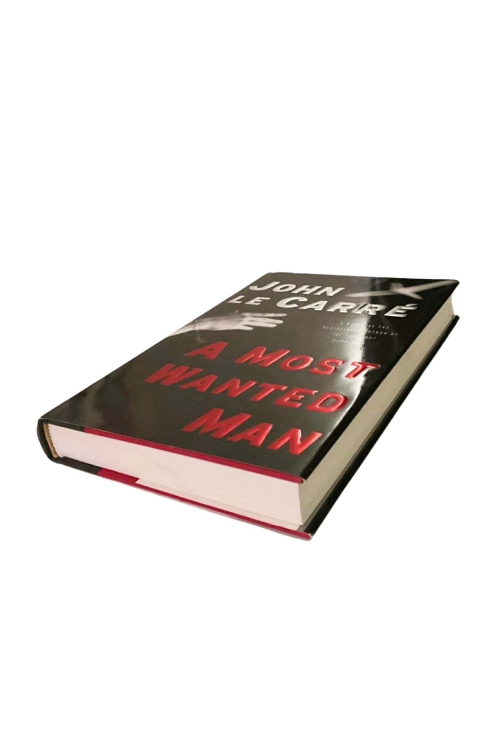 Book titled 'A Most Wanted Man' by John Le Carre, showing the front cover and edges on a white background