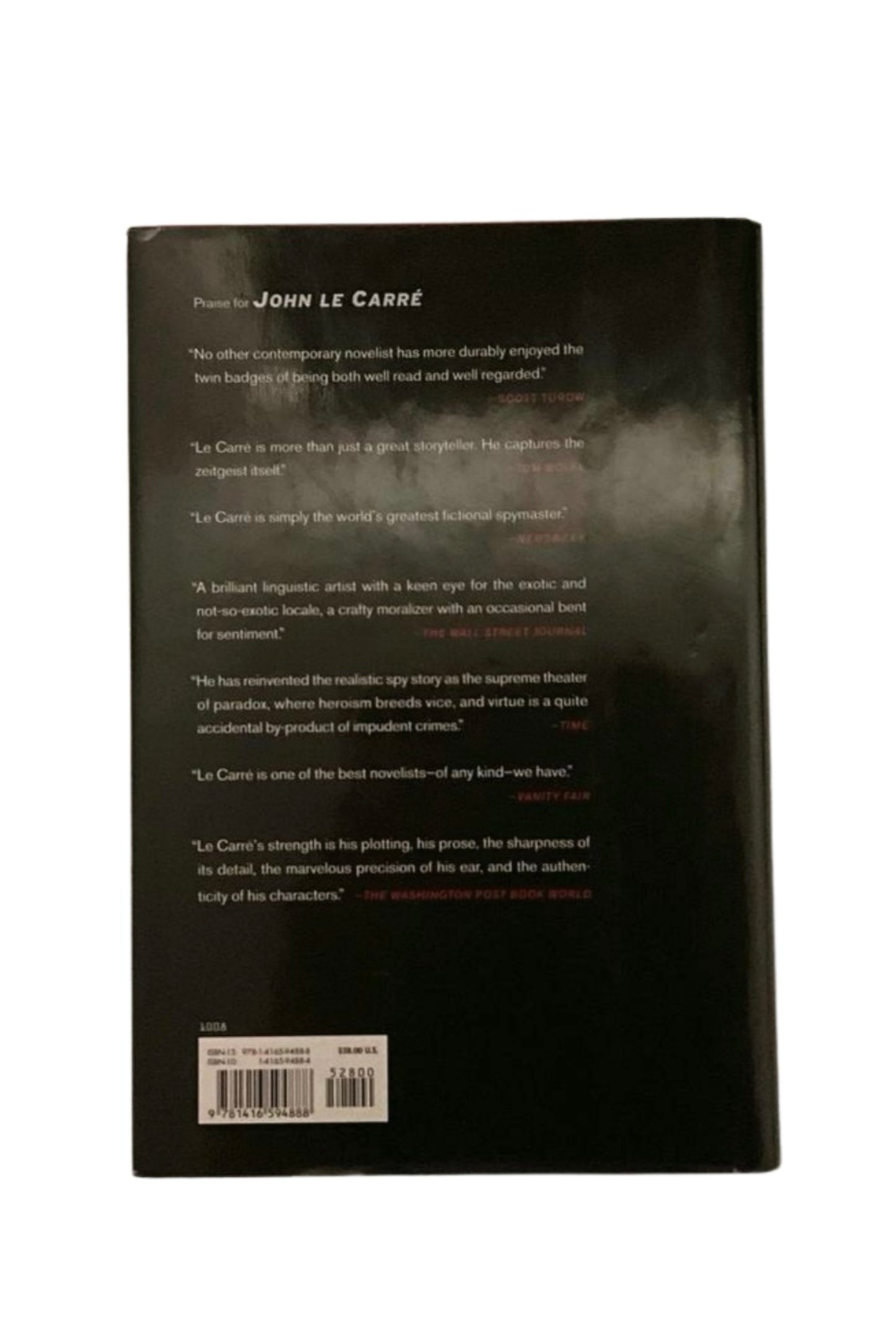 Back cover of a book with text and a barcode on a white background