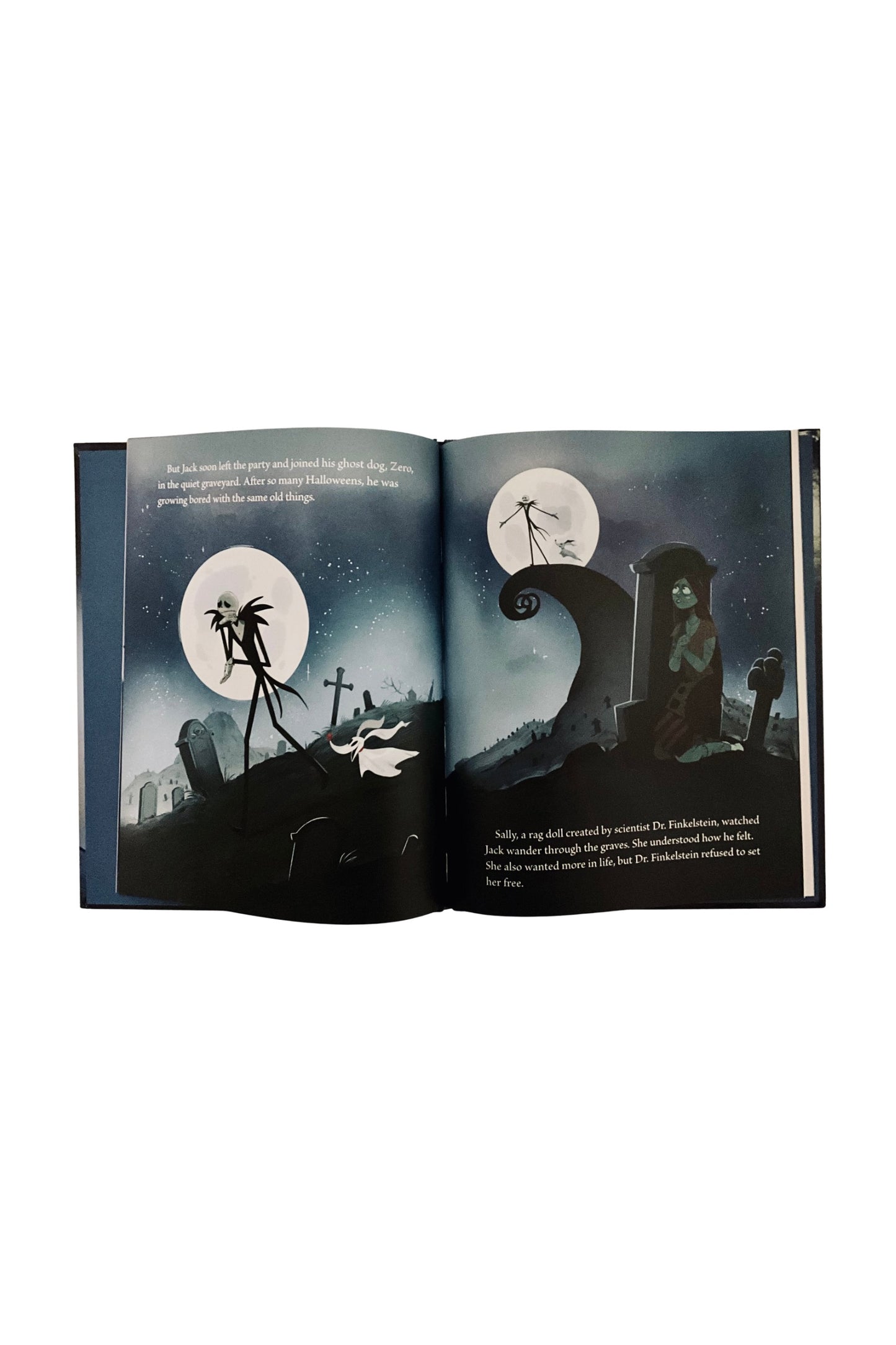 Open book with illustrations of a graveyard scene and characters, against a dark blue night sky.