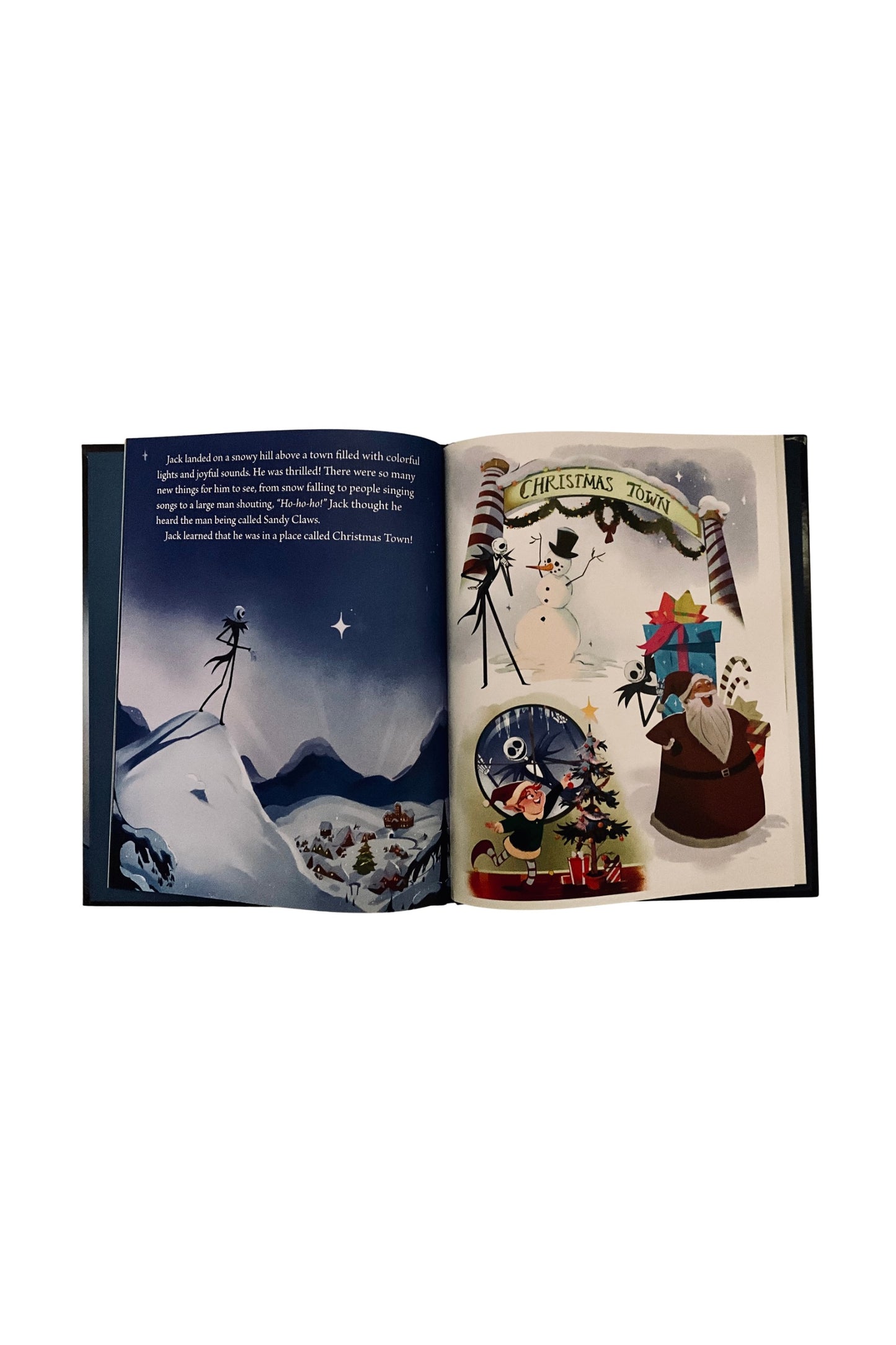 Open book with Christmas-themed illustrations on a white background