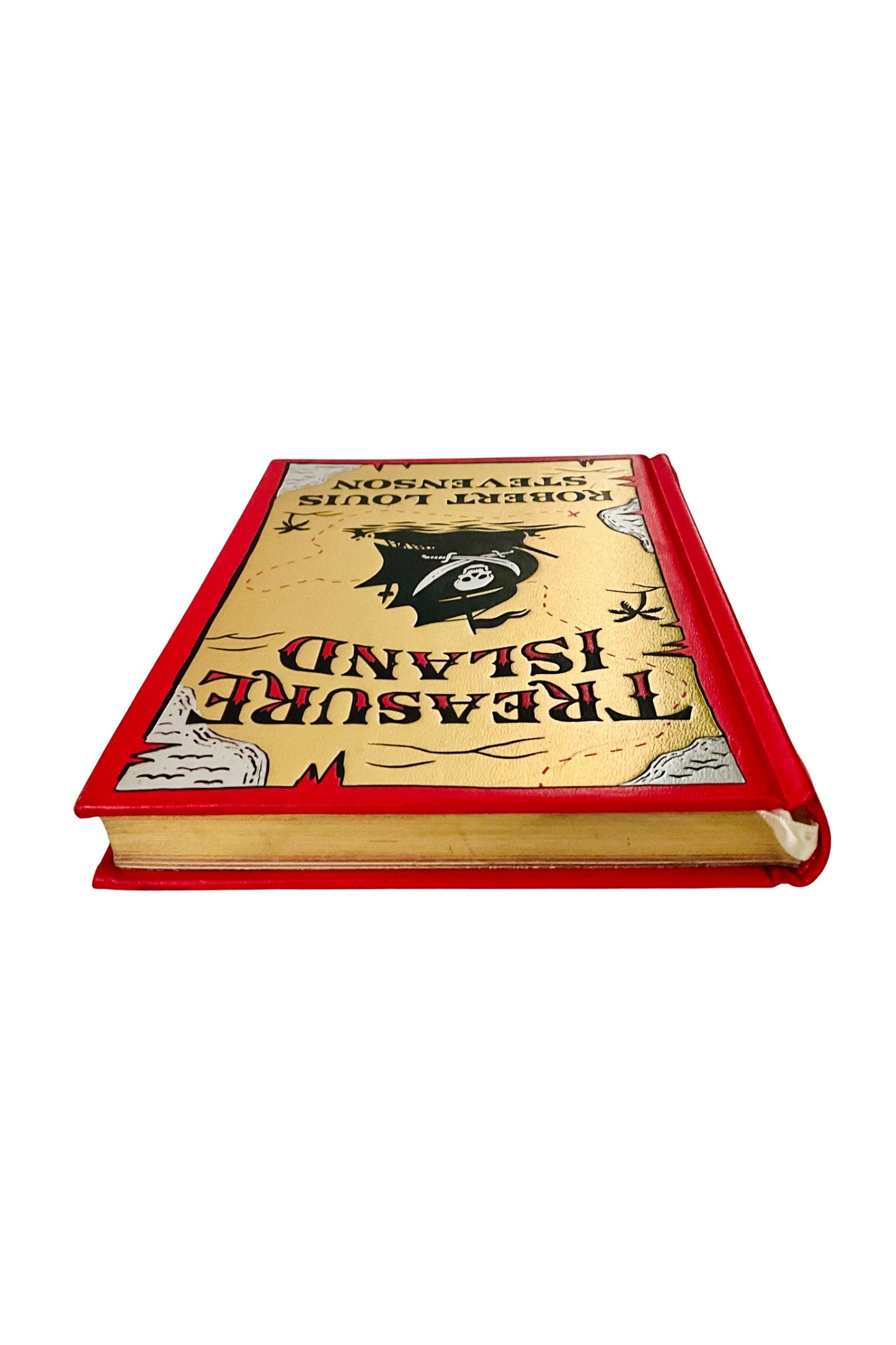 Book with a red spine and gold cover on a white background