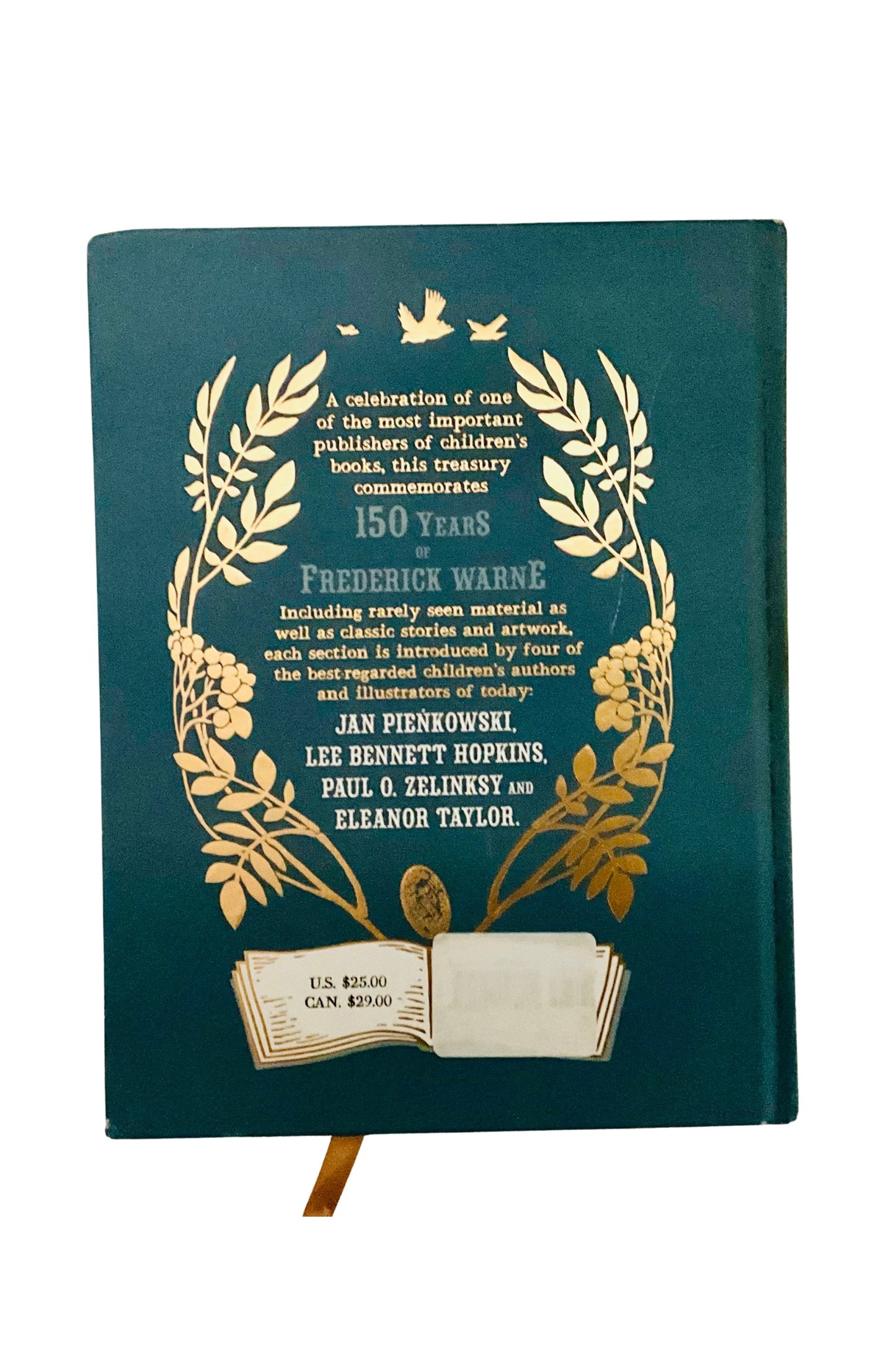Decorative book with gold embossed text and design on a green background
