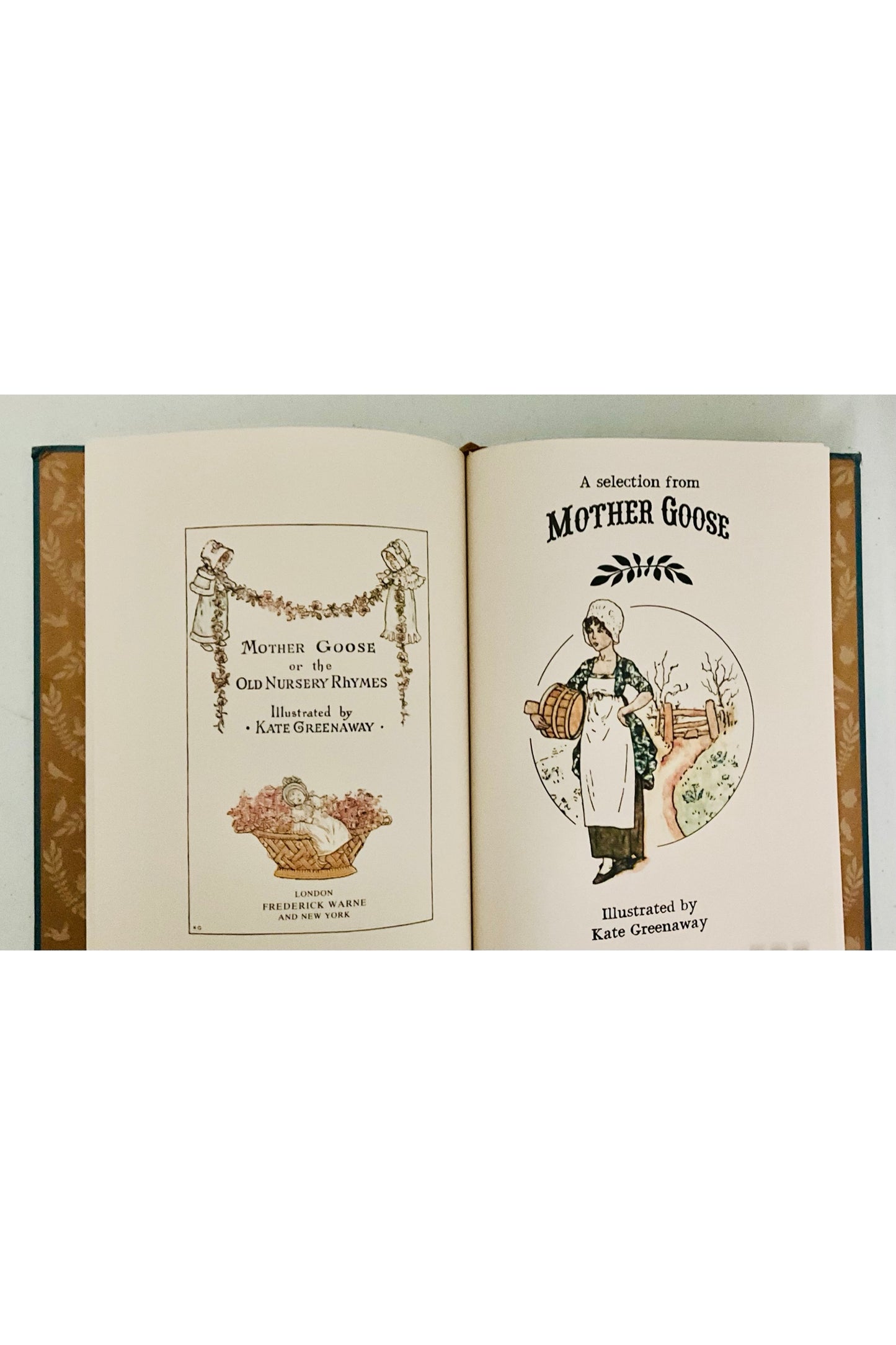 Open book showing a section titled 'A Selection from Mother Goose' with charming illustrations on a white background