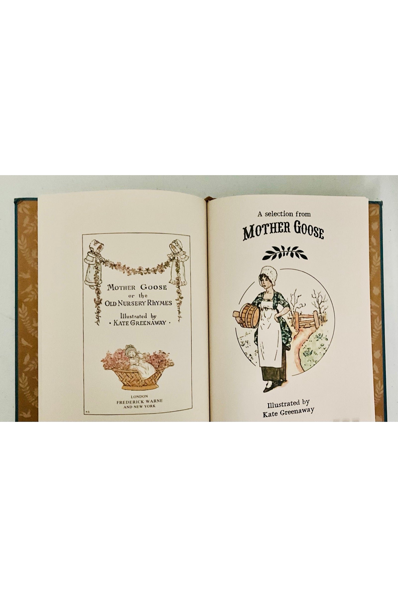 Open book showing a section titled 'A Selection from Mother Goose' with charming illustrations on a white background