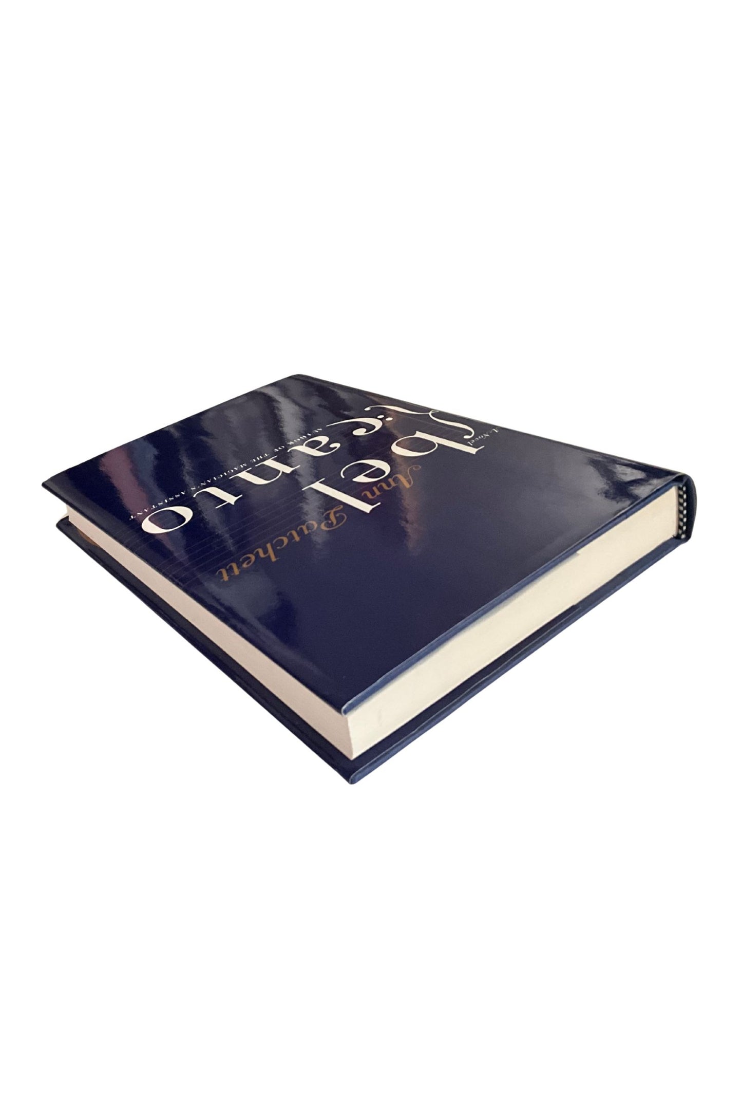 Blue-bound book with white and gold lettering on a white background