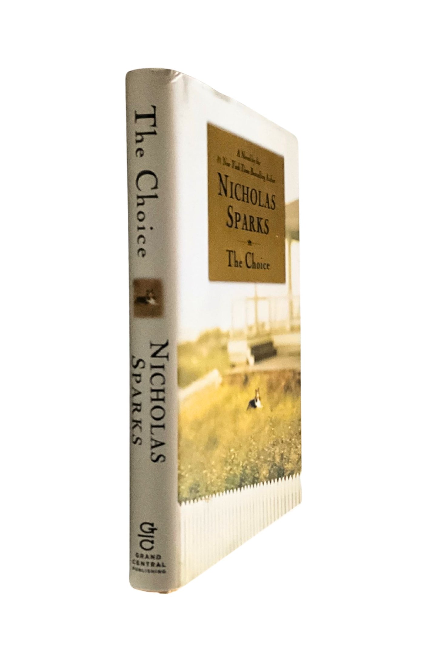 Book titled 'The Choice' by Nicholas Sparks on a white background, the angle shows the book’s spine