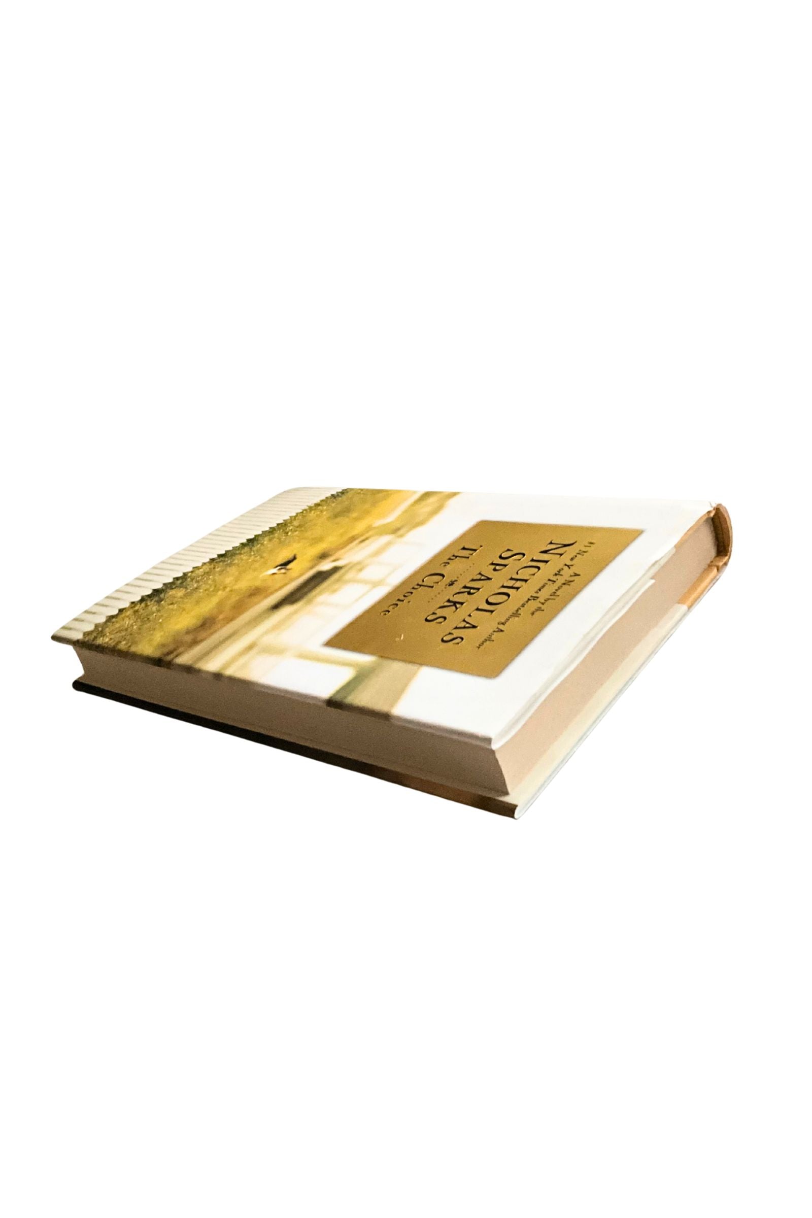 Book with gold cover and text on a white background