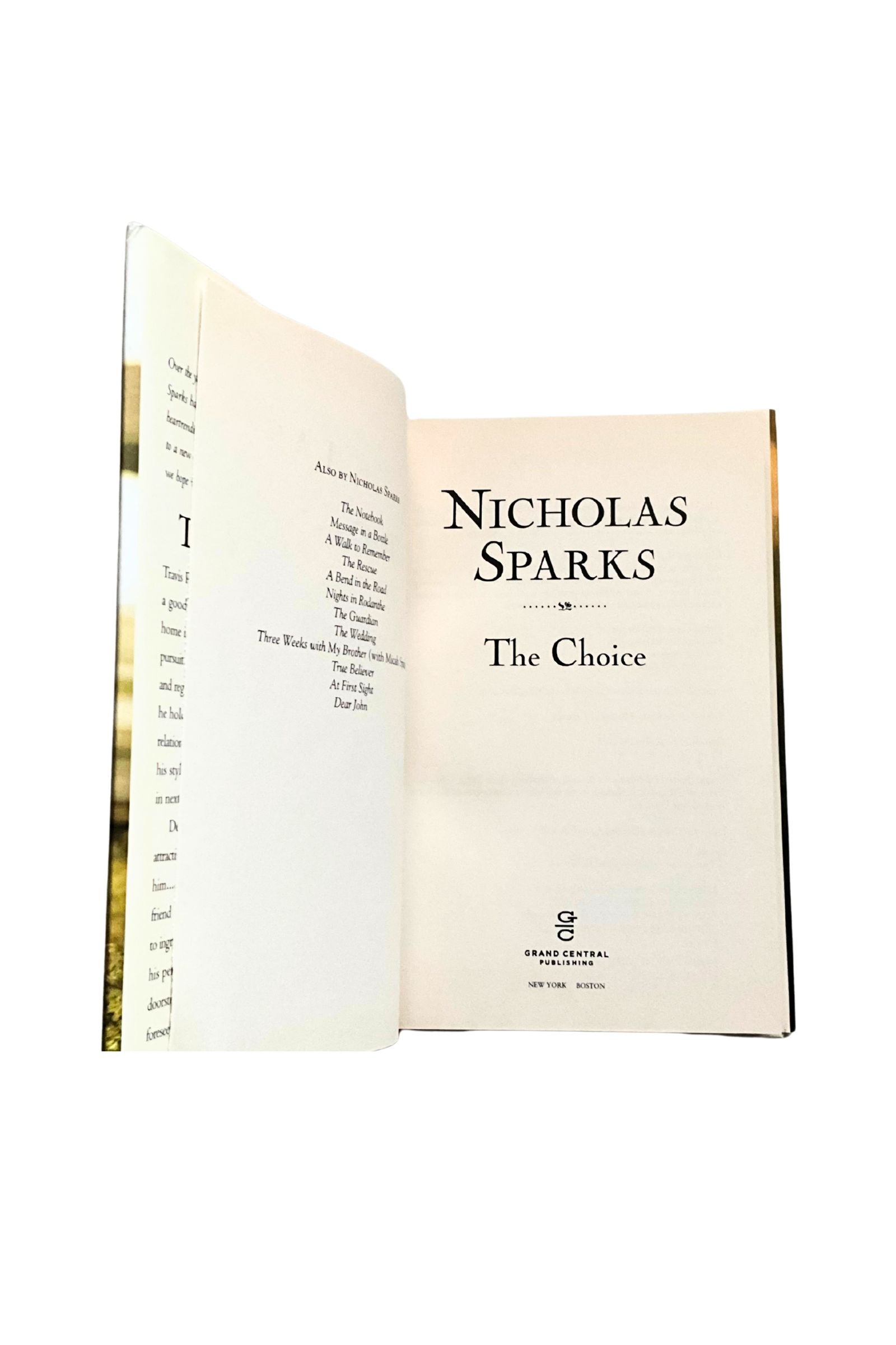 Open book titled 'The Choice' by Nicholas Sparks on a white background