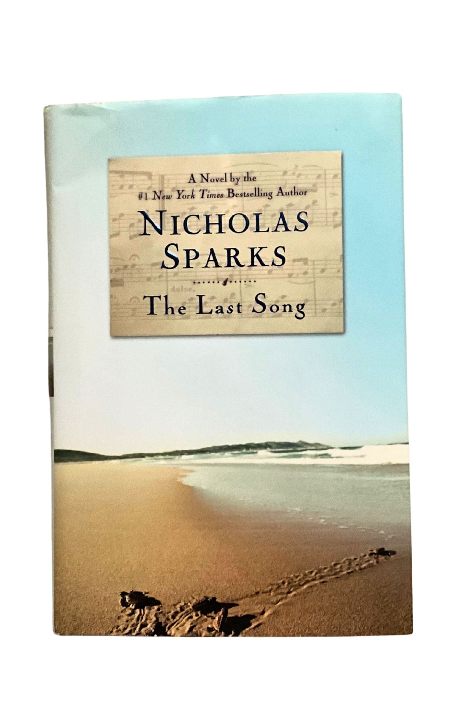 Book cover of 'The Last Song' by Nicholas Sparks with a beach scene