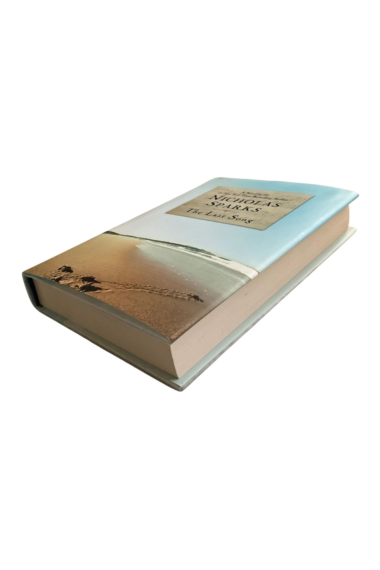 Book showing the front cover and edges on a white bacground