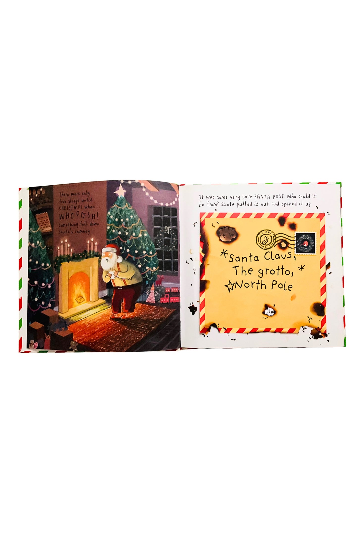 Illustrated book open to a page with a Christmas scene and letter to Santa Claus.