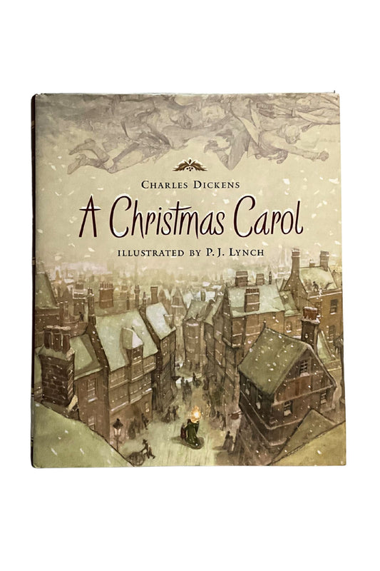 Book cover of 'A Christmas Carol' by Charles Dickens with illustration of a snowy village scene.