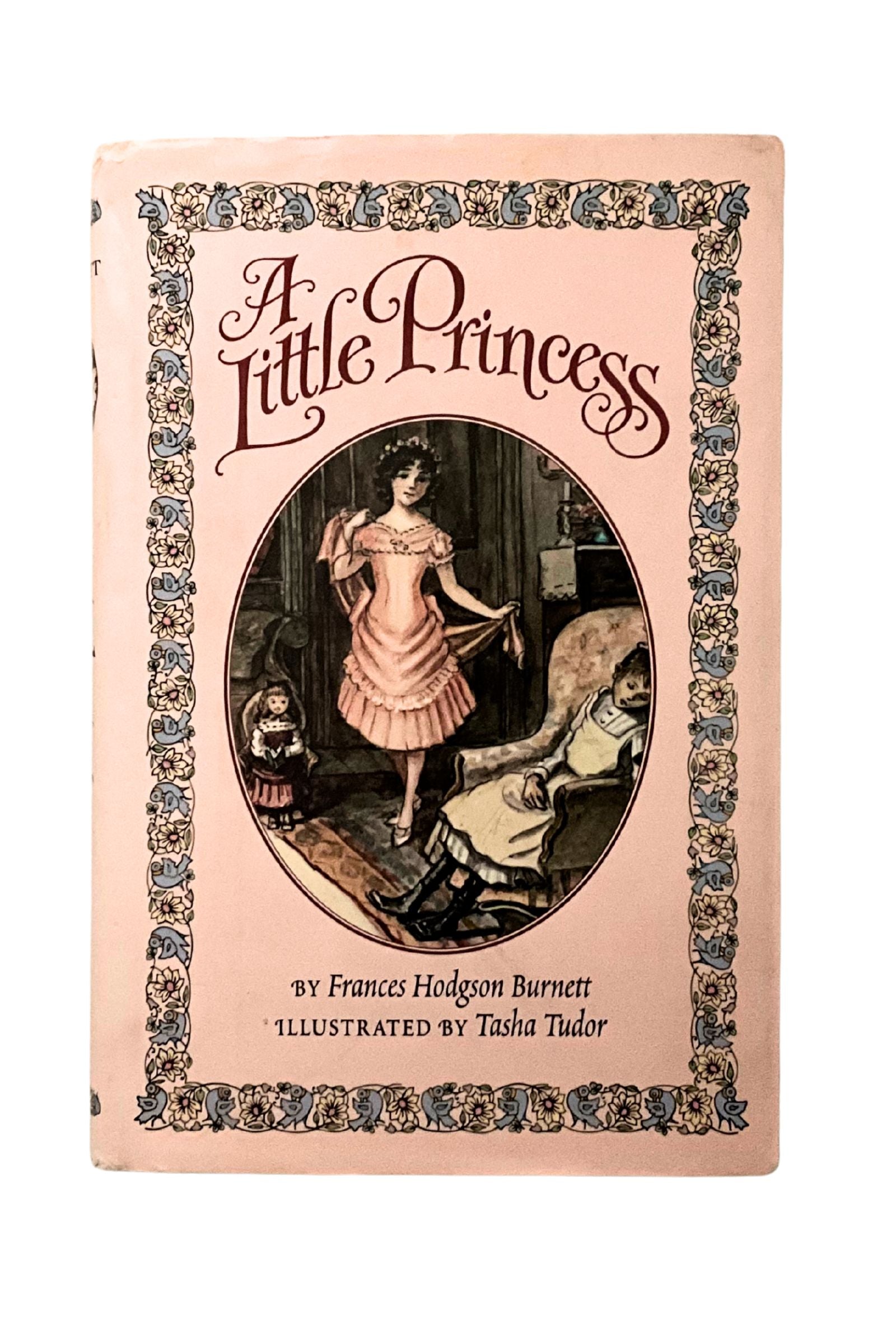 Book cover of 'A Little Princess' with decorative border and illustration of a girl in a pink dress.