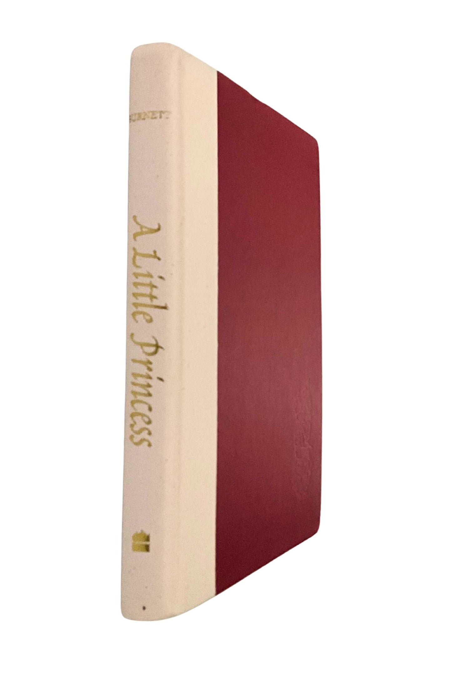 Book titled 'A Little Princess' with red and beige cover on a white background