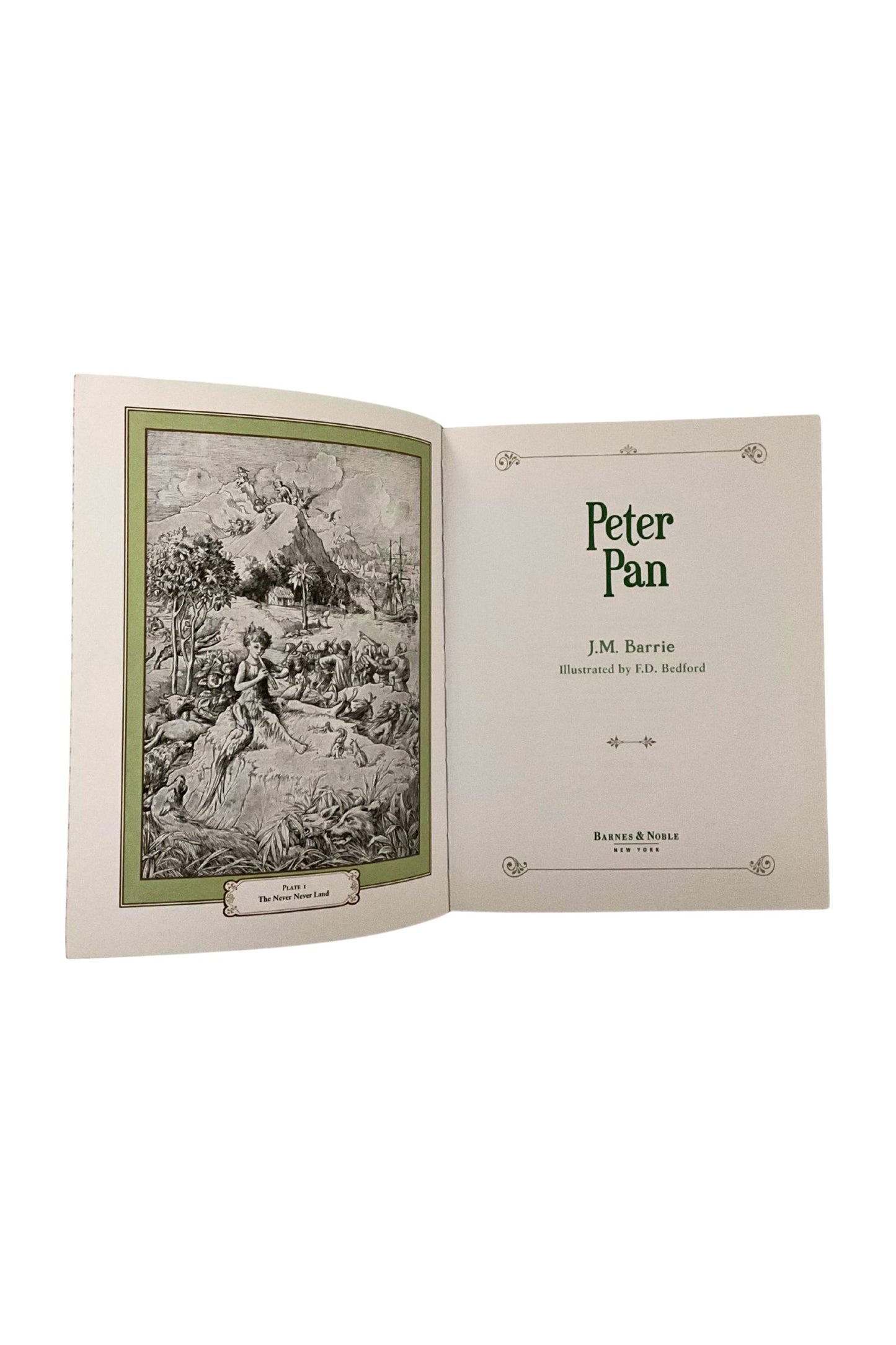 Open book titled 'Peter Pan' by J.M. Barrie on a white background