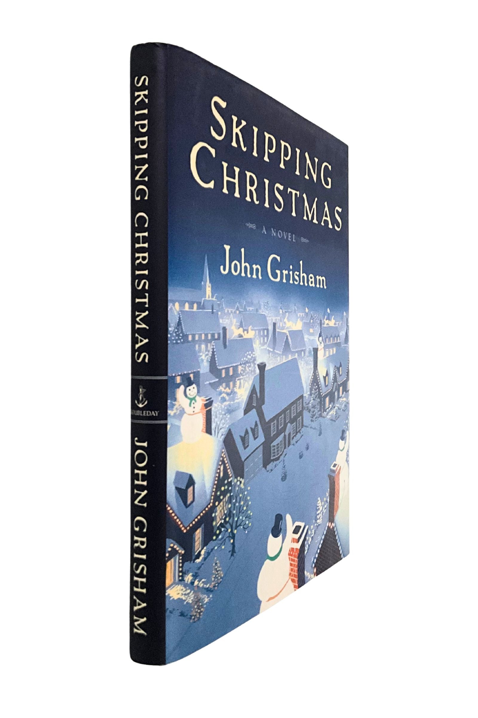 Book titled 'Skipping Christmas' by John Grisham with a festive cover design. The angle of the book is showing the spine