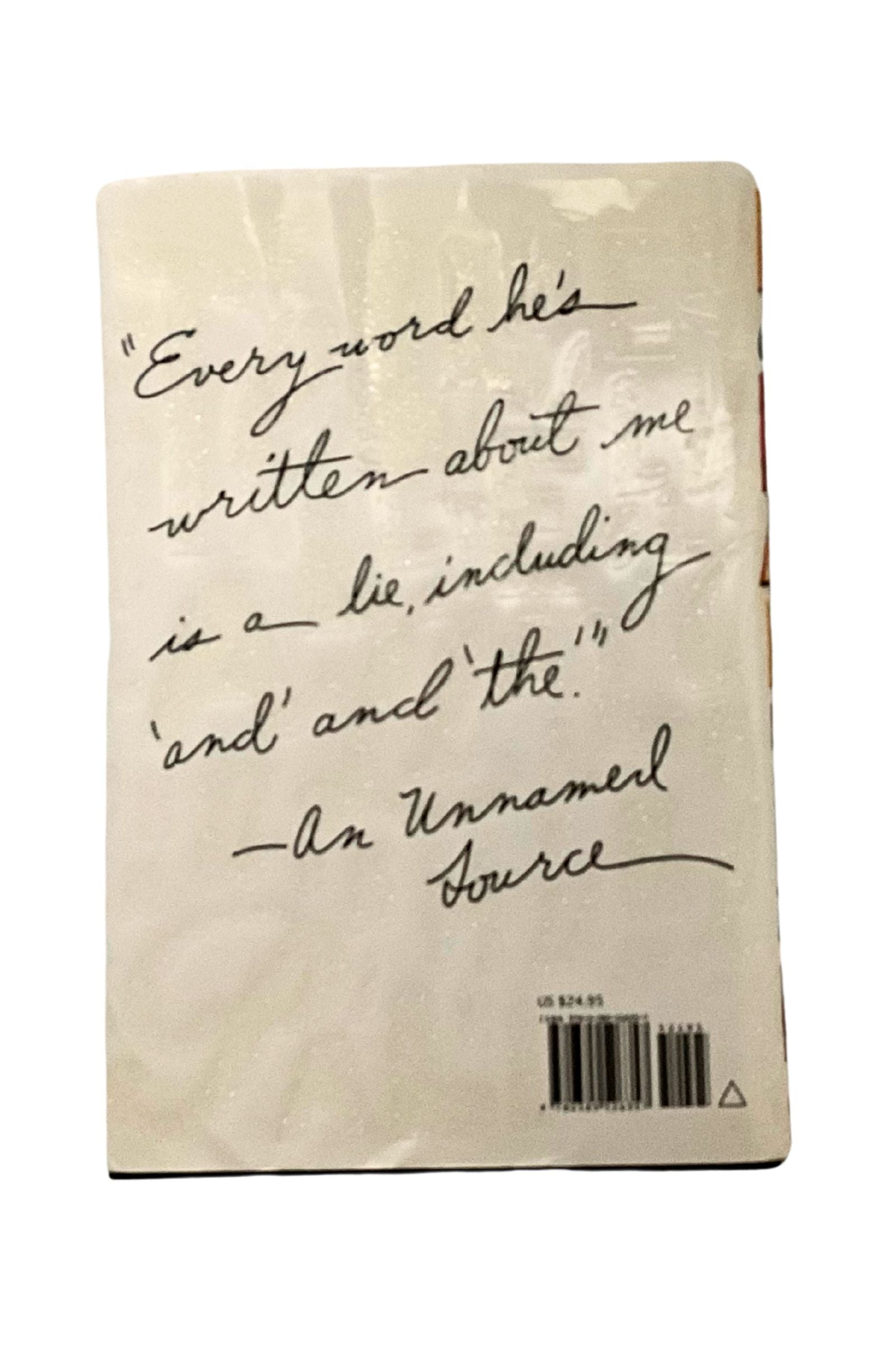 Book cover with handwritten text and a barcode on a white background
