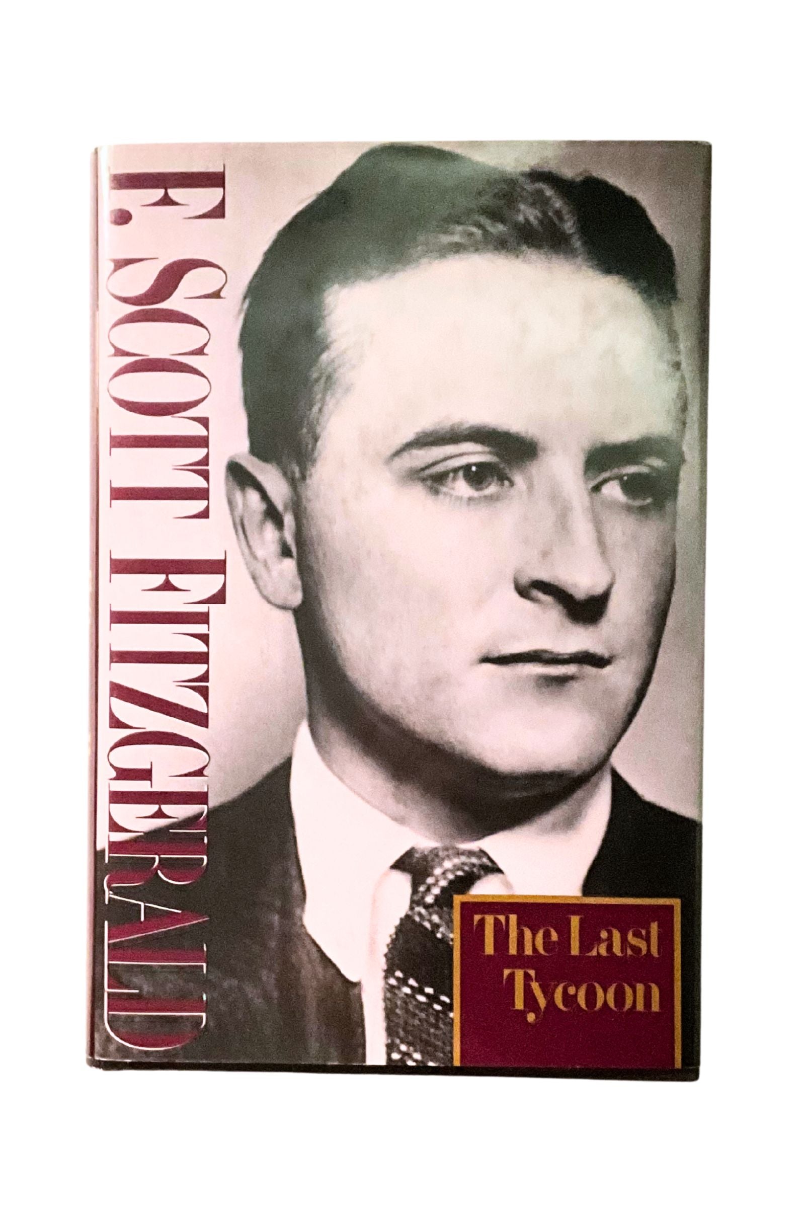 Book cover of 'The Last Tycoon' by F. Scott Fitzgerald with a portrait on the cover.