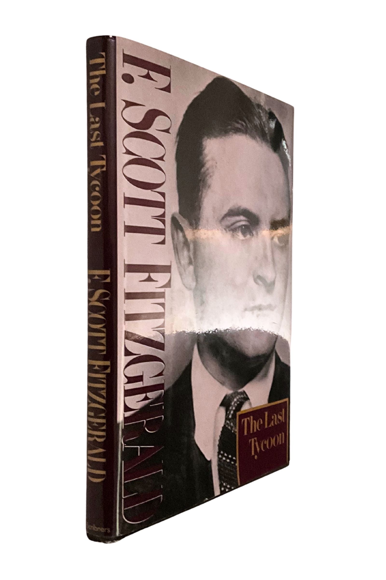 Book cover of 'The Last Tycoon' by F. Scott Fitzgerald with a portrait on the cover, with the spine showing