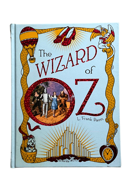 Book cover of 'The Wizard of Oz' with colorful design elements on a light blue background