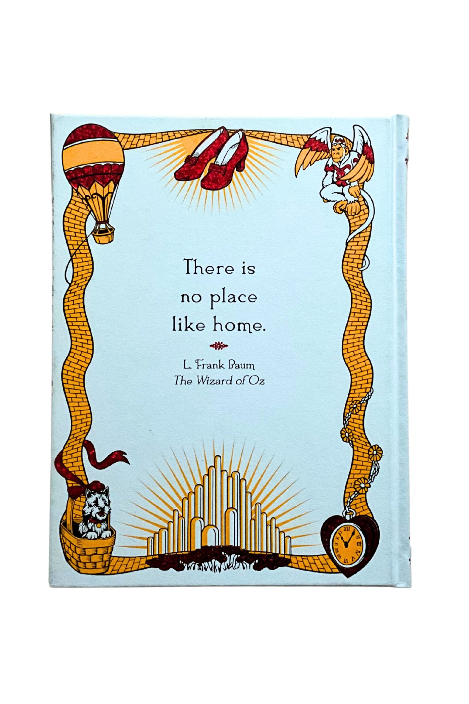 Back cover of the book ‘The  Wizard of Oz’ featuring colorful designs and symbols on a light blue background