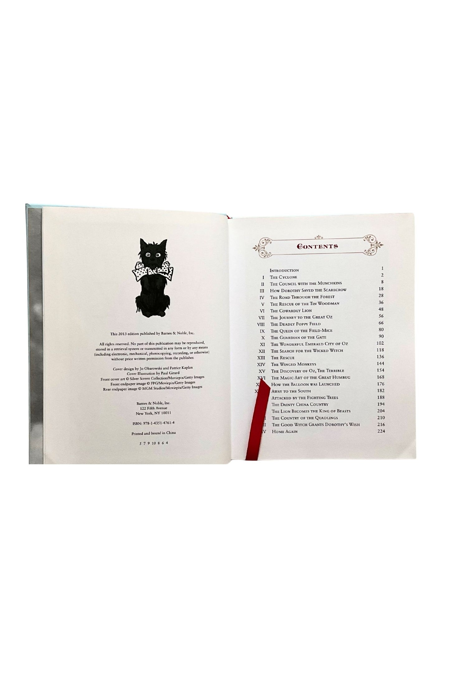 Open book with a black cat illustration on the copyright page on the left and a table of contents on the right page.