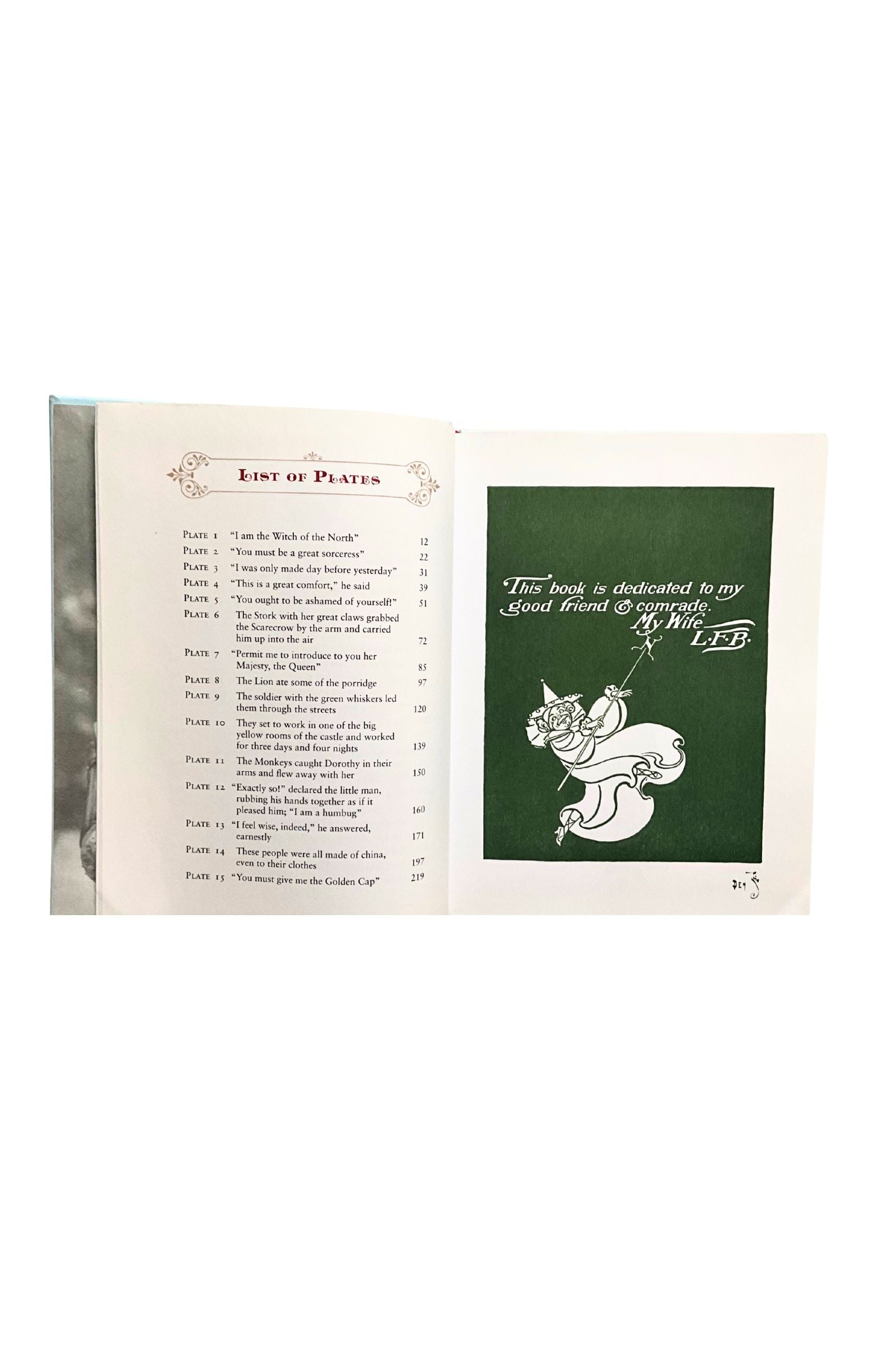 Open book with a list of plates and a dedication page on a white background