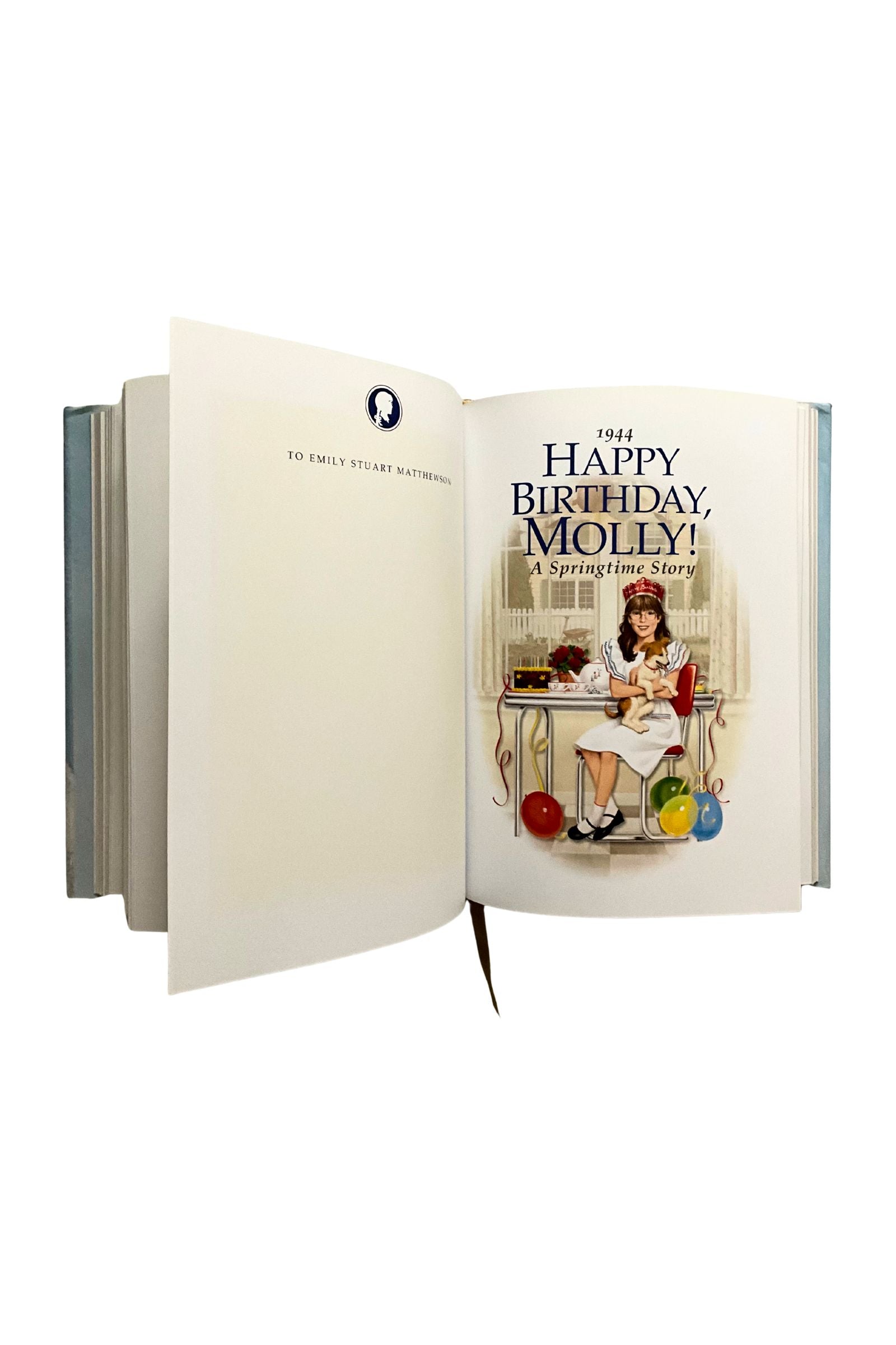 Open book showing a page with an illustration of a young girl celebrating her birthday on a white background