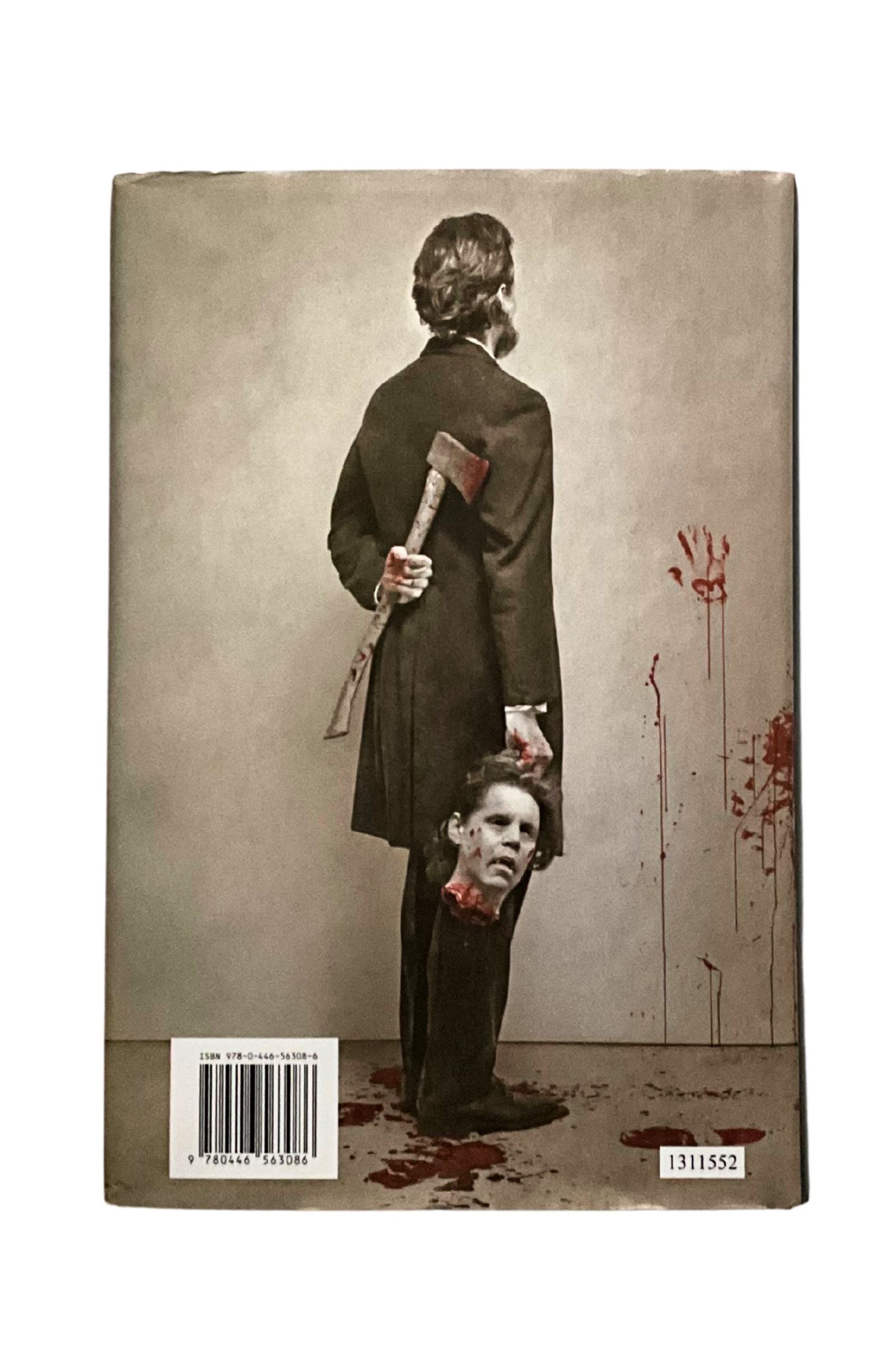 Back cover with a graphic design of Abraham Lincoln holding an axe over another person's head, with bloodstains on a white background.