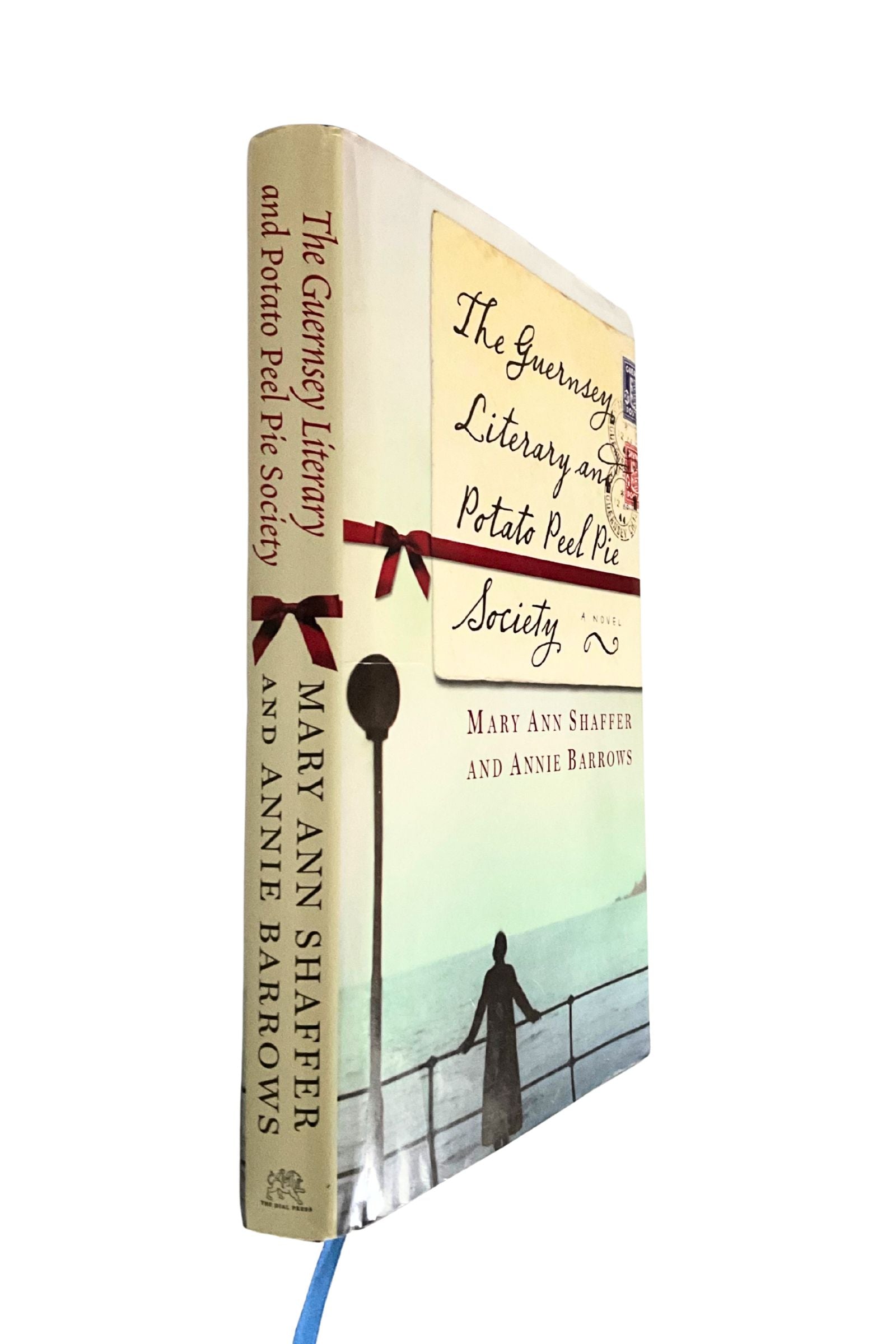 Book titled 'The Guernsey Literary and Potato Peel Pie Society' by Mary Ann Shaffer and Annie Barrows on a white background