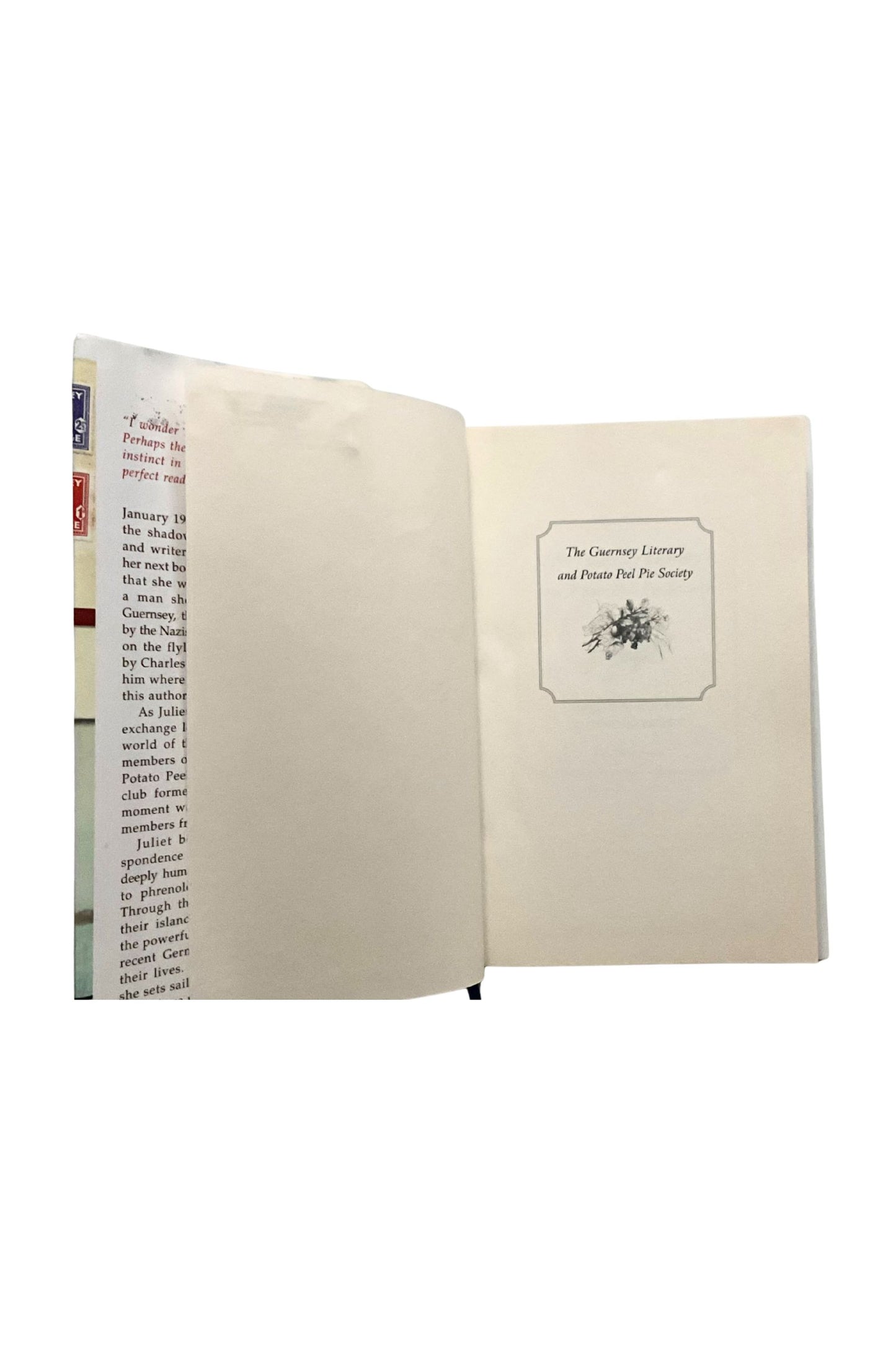 Open book with text and a small illustration on a white background