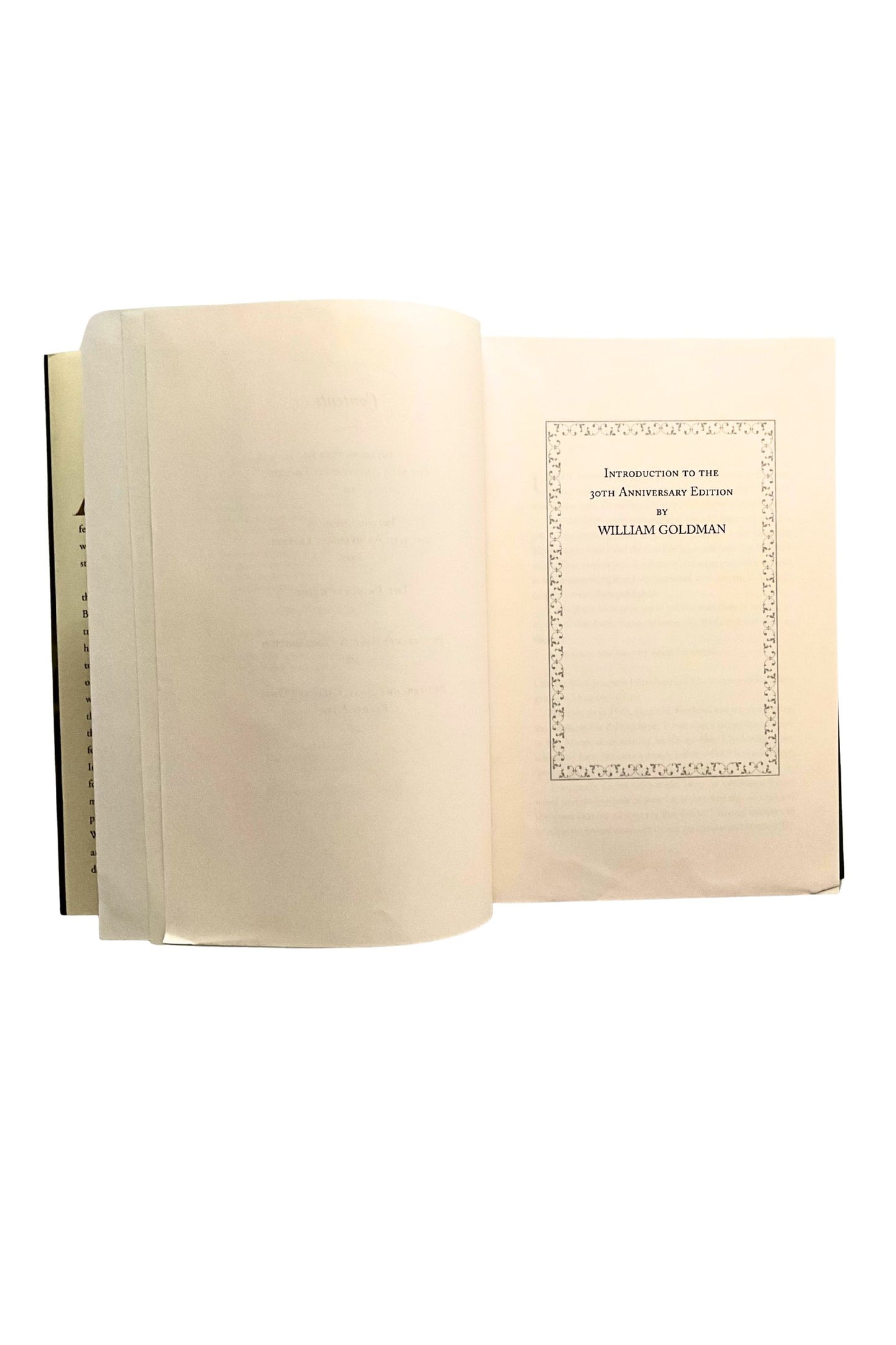 Open book with a decorative page on a white background