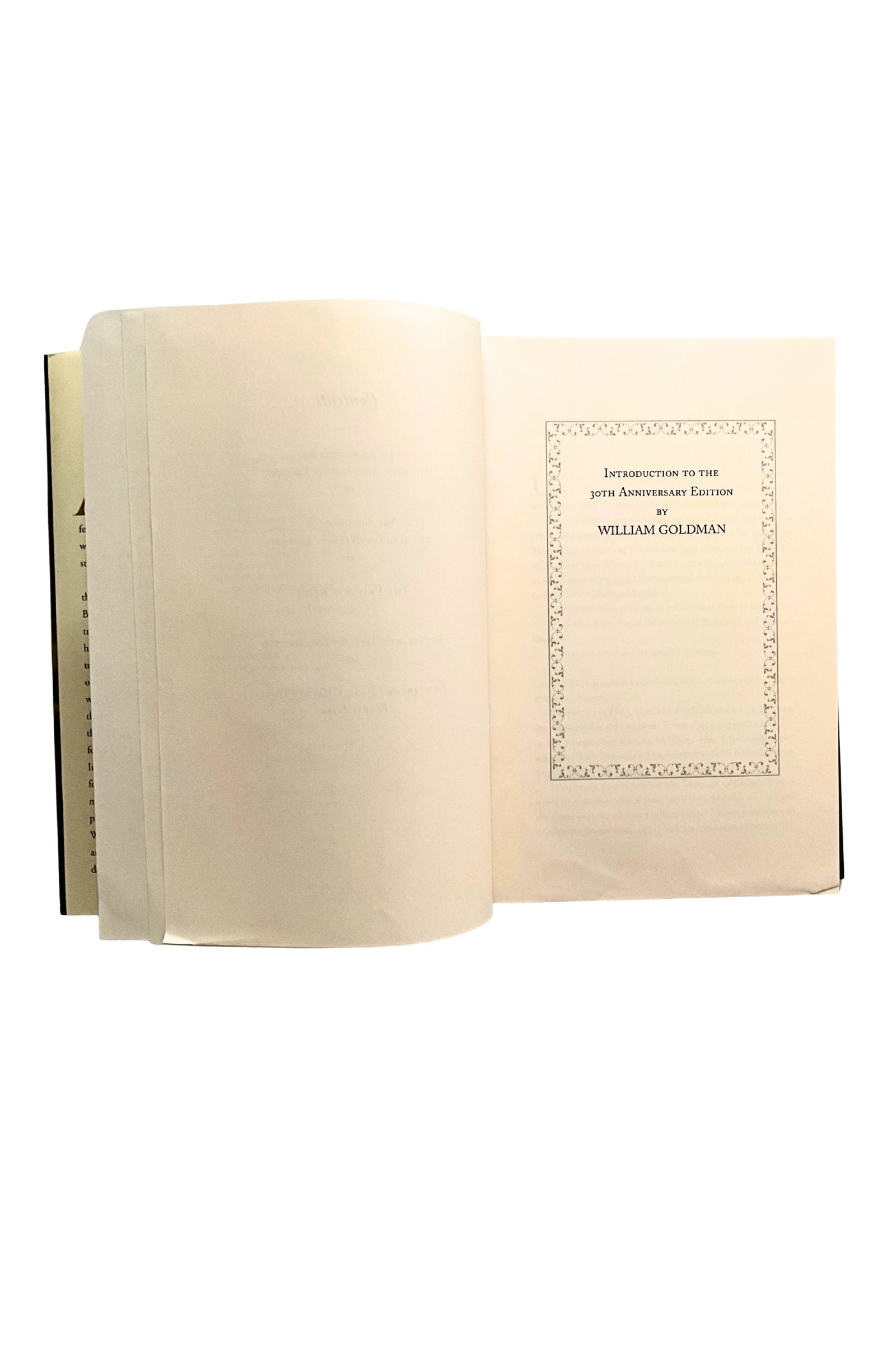 Open book with a decorative page on a white background