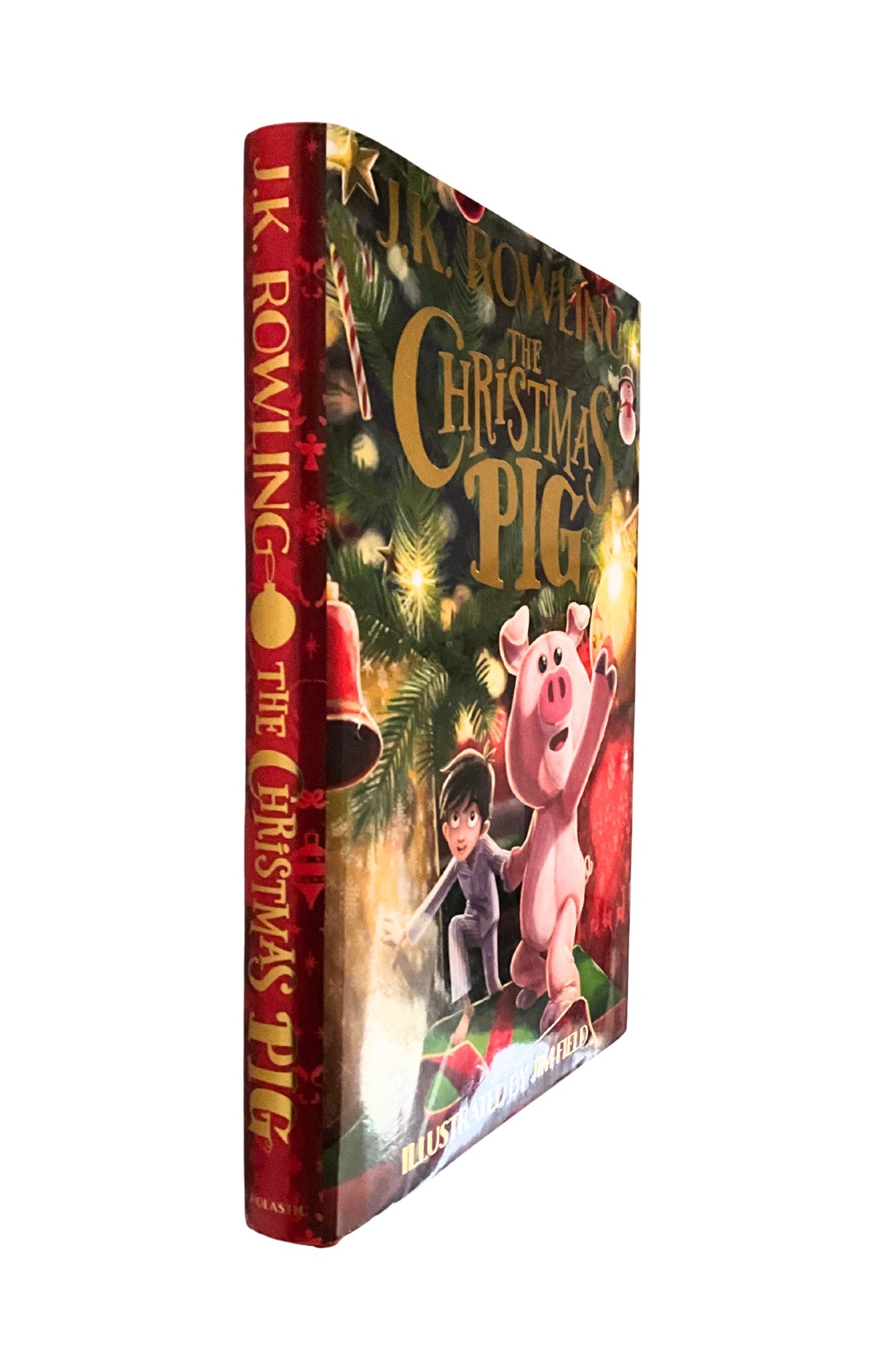 Book titled 'The Christmas Pig' by J.K. Rowling with a colorful cover featuring a pig and a child.