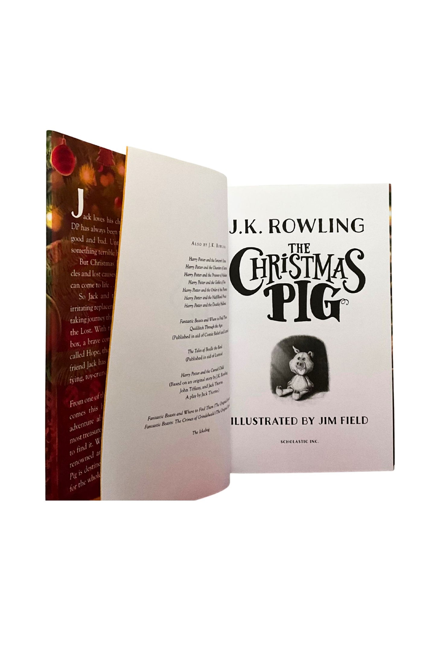 Book titled 'The Christmas Pig' by J.K. Rowling with an illustration of a pig under the title