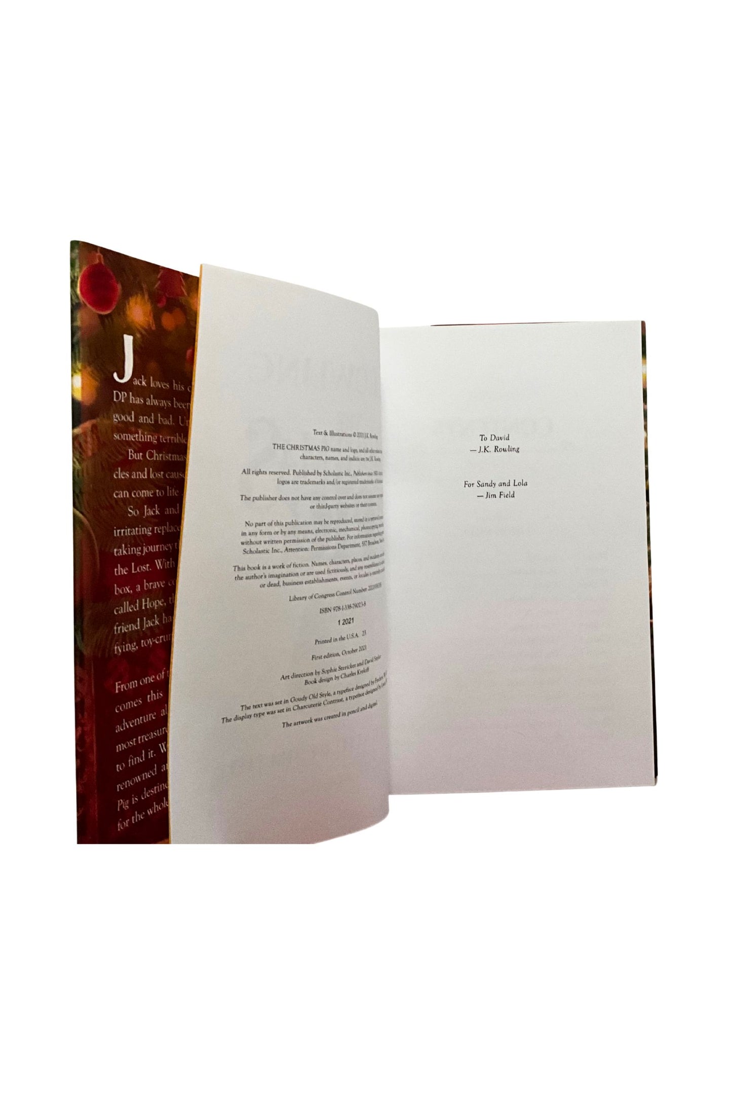 Open book with text and a decorative cover on a white background