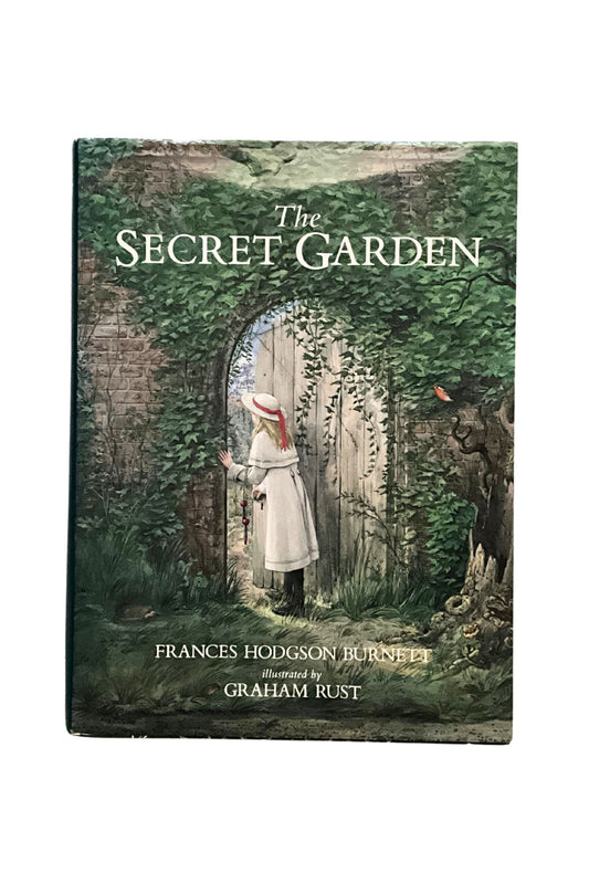 Front cover of ‘The Secret Garden’ showing a young girl in Victorian times entering a garden