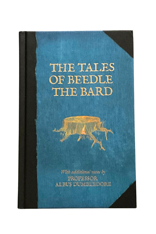 Book titled 'The Tales of Beedle the Bard' with a blue cover and black spine on a white background