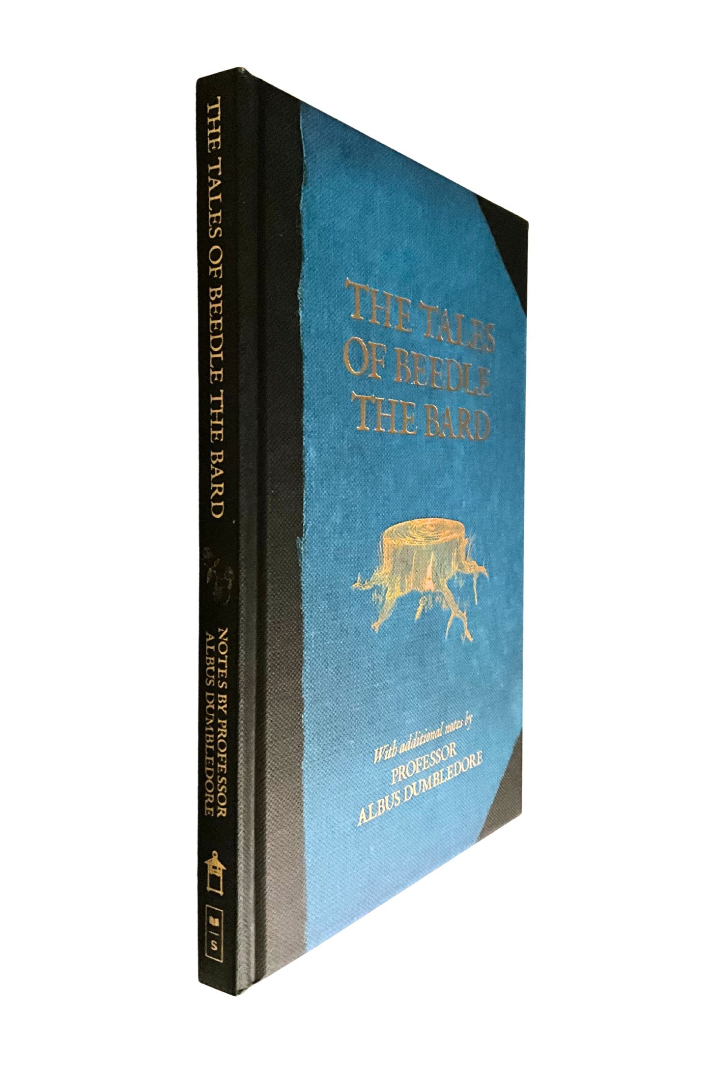 Book titled 'The Tales of Beedle the Bard' with a blue cover and gold text on a white background