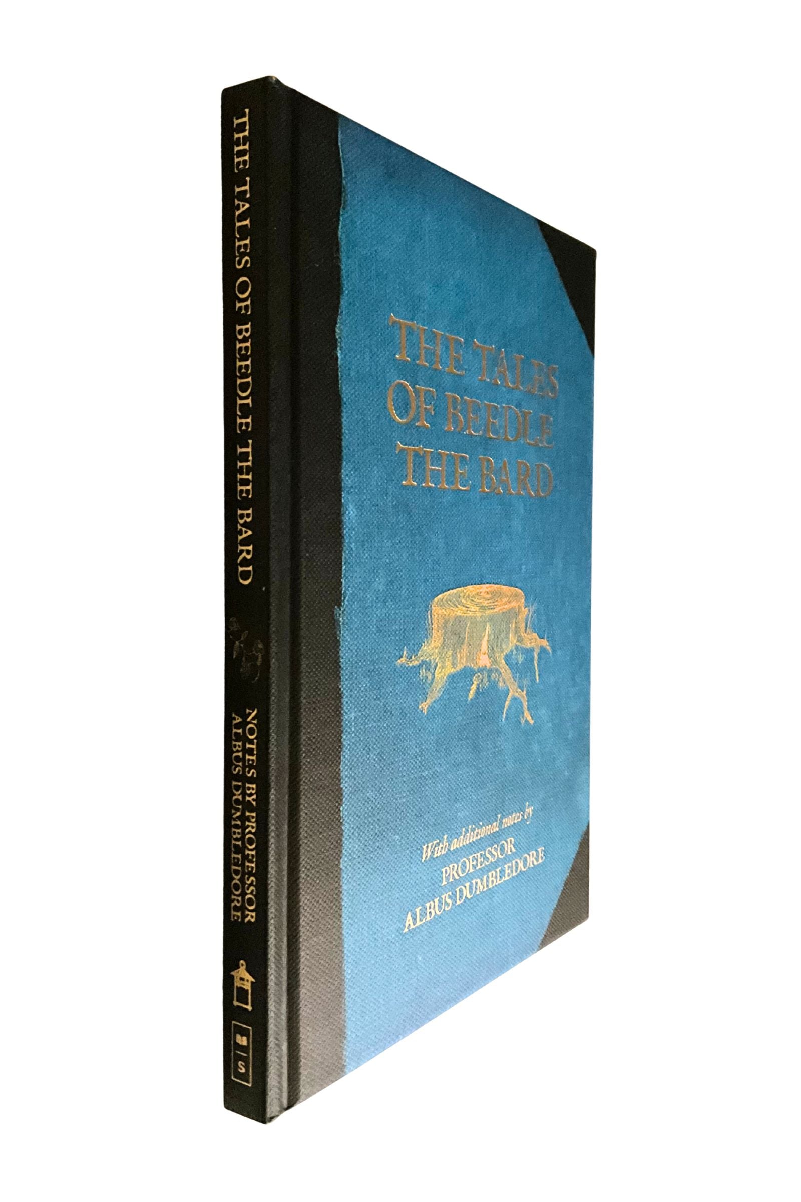 Book titled 'The Tales of Beedle the Bard' with a blue cover and gold text on a white background