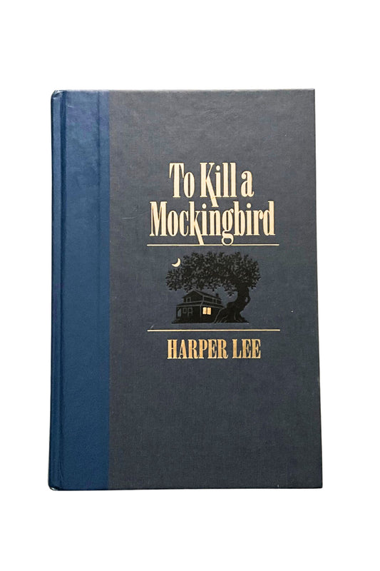 Book titled 'To Kill a Mockingbird' by Harper Lee with a blue cover and gold text.