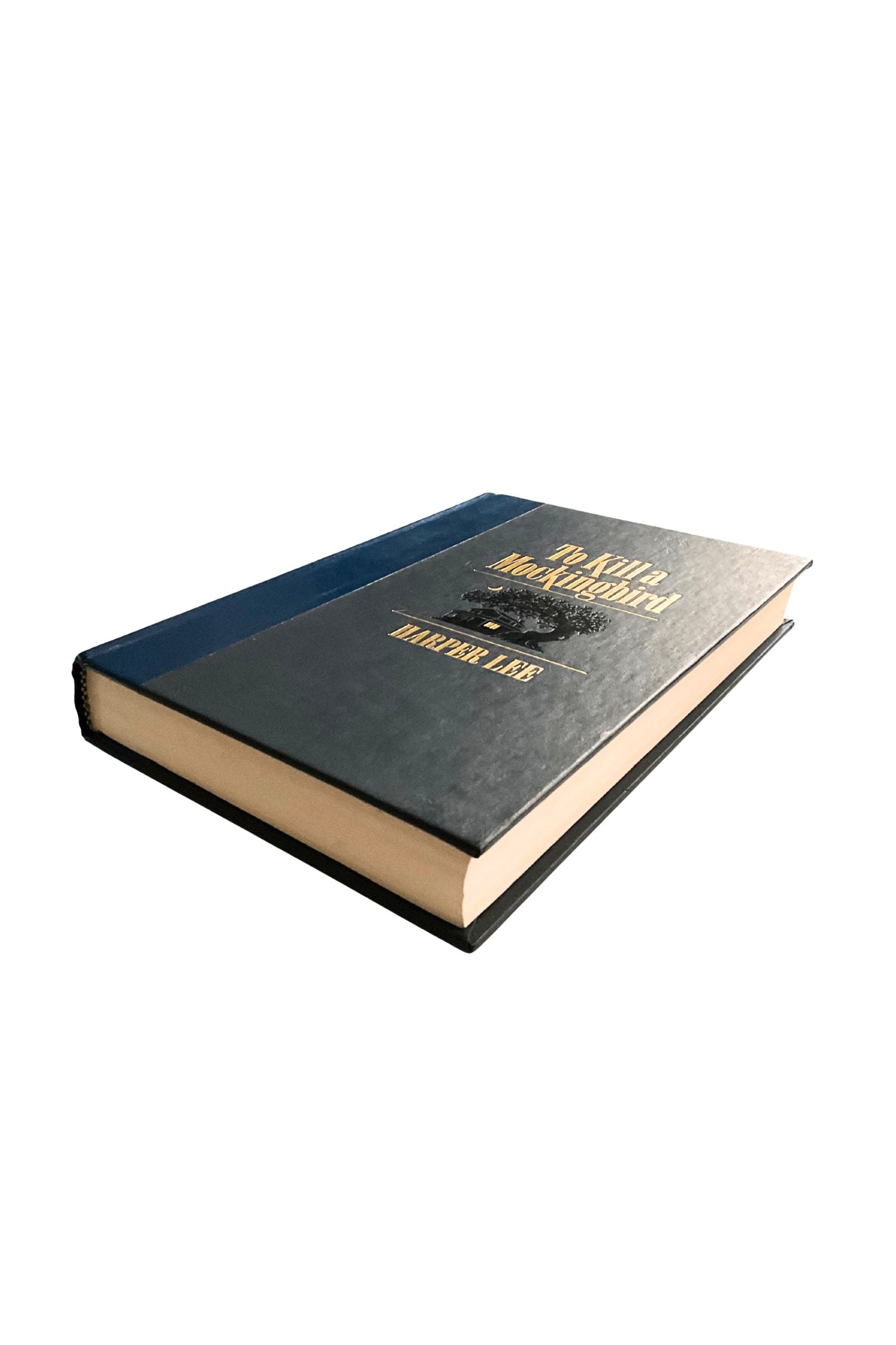 Book titled 'To Kill a Mockingbird' with a blue cover and gold letters  on a white background