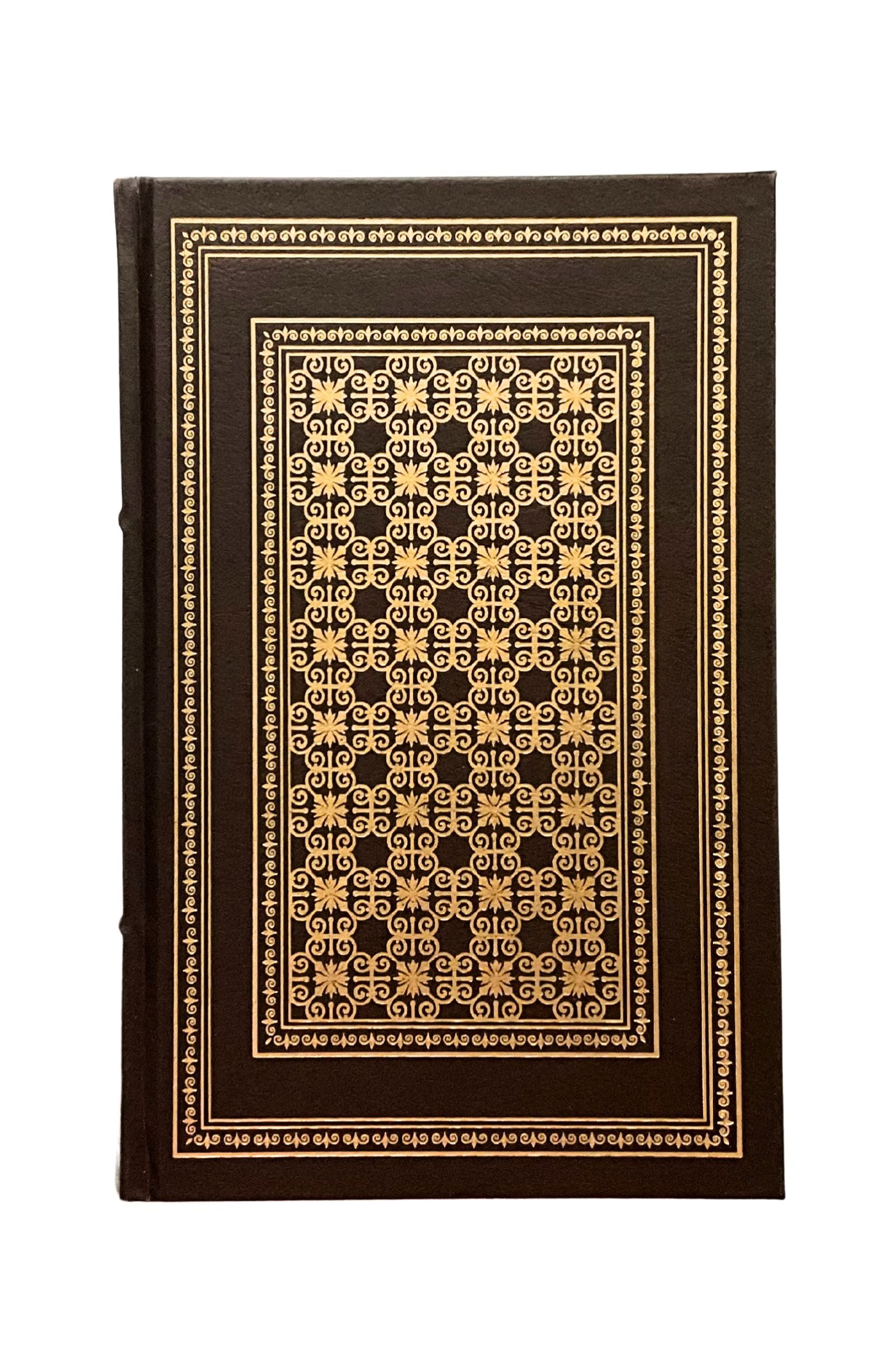 Decorative book with intricate gold pattern on a white background