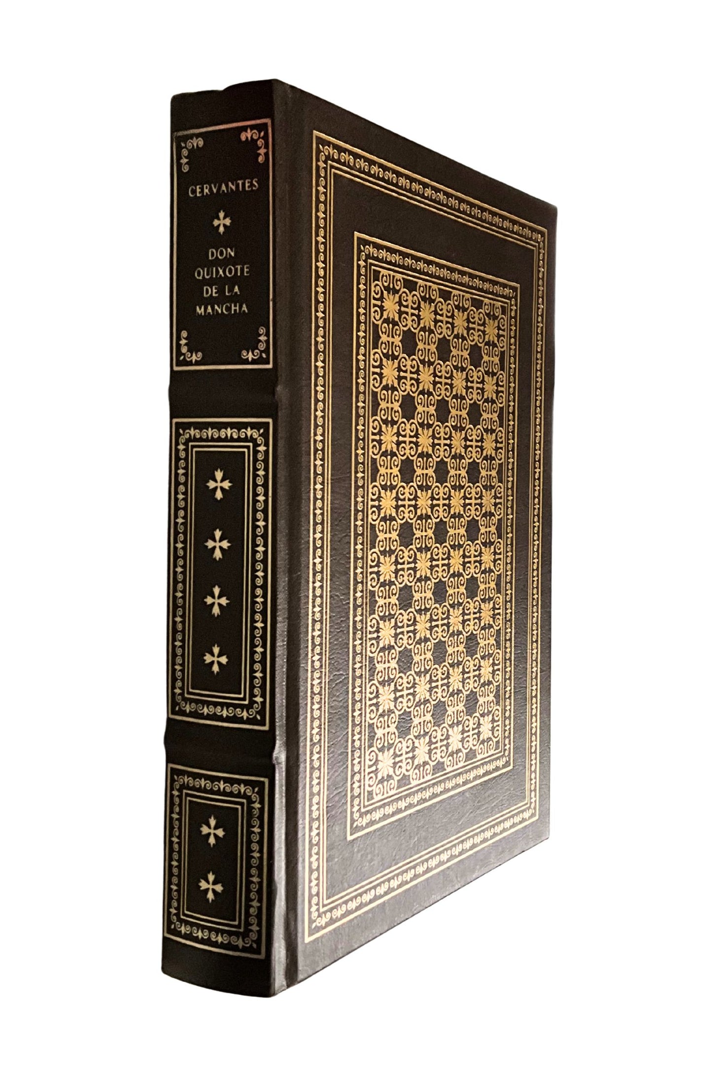 Decorative book with intricate gold patterns on a white background, angled to show the spine details