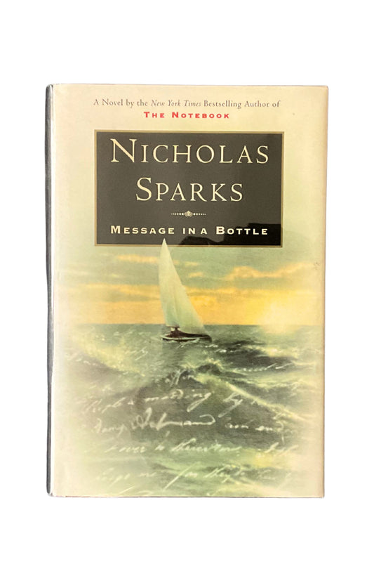 Book cover of 'Message in a Bottle' by Nicholas Sparks with a sailboat on the water.